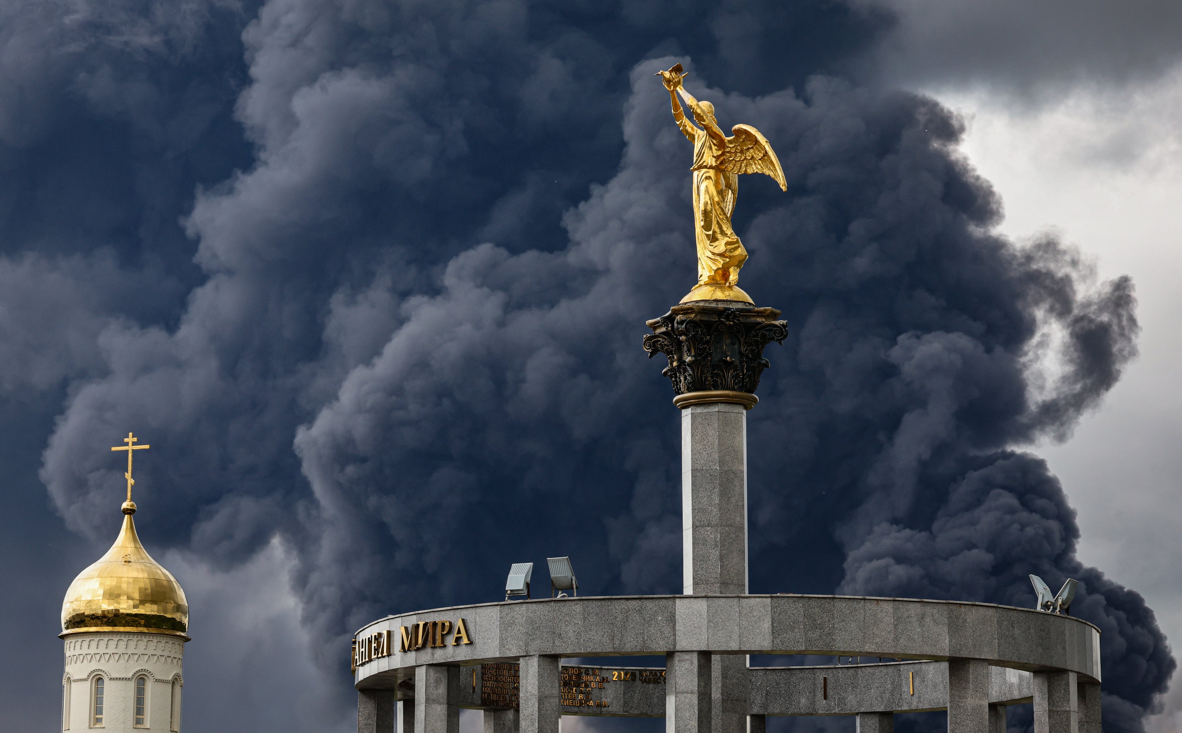 Smoke billows behind an Orthodox church following a reported Ukrainian drone attack, in Moscow, Russia, on Thursday. Photo: EPA