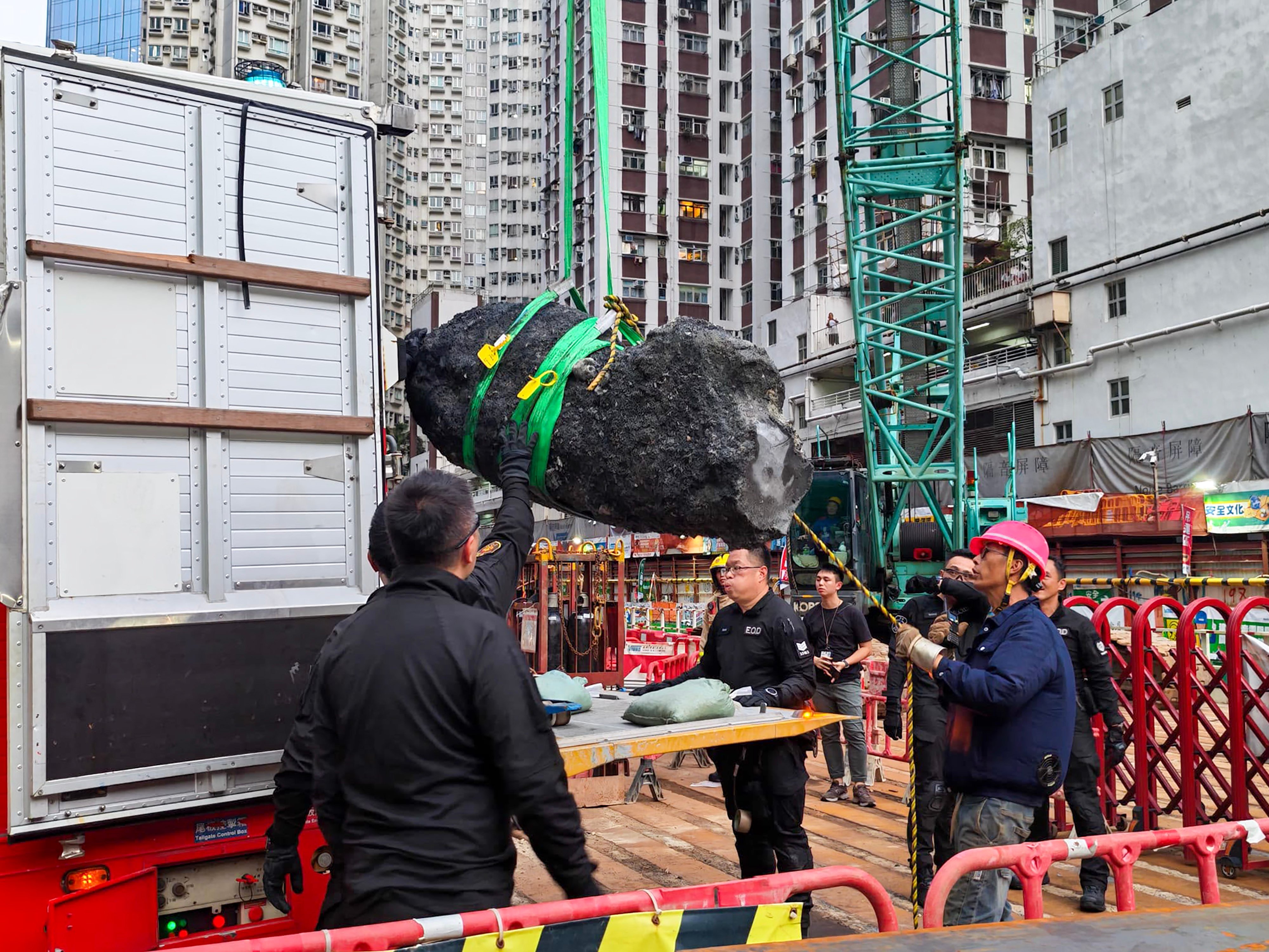 Workers remove the object from the site. Photo: Handout
