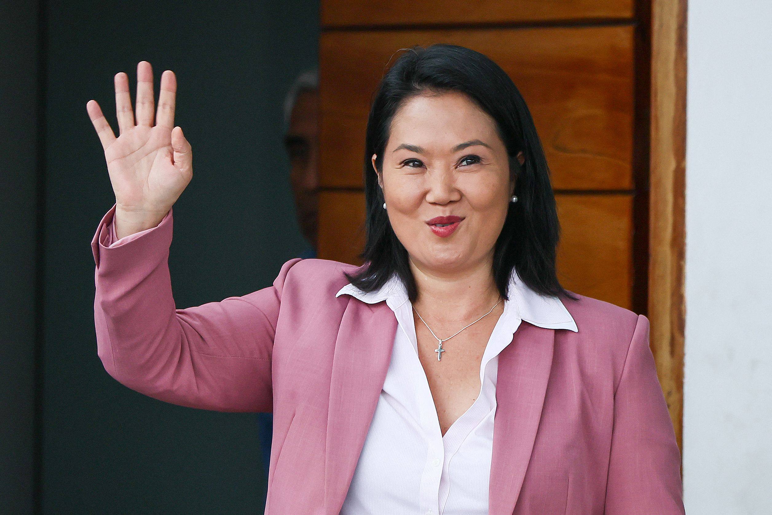 Keiko Fujimori waves as she leaves her home in San Borja district, Lima, on Wednesfay. Photo: AFP