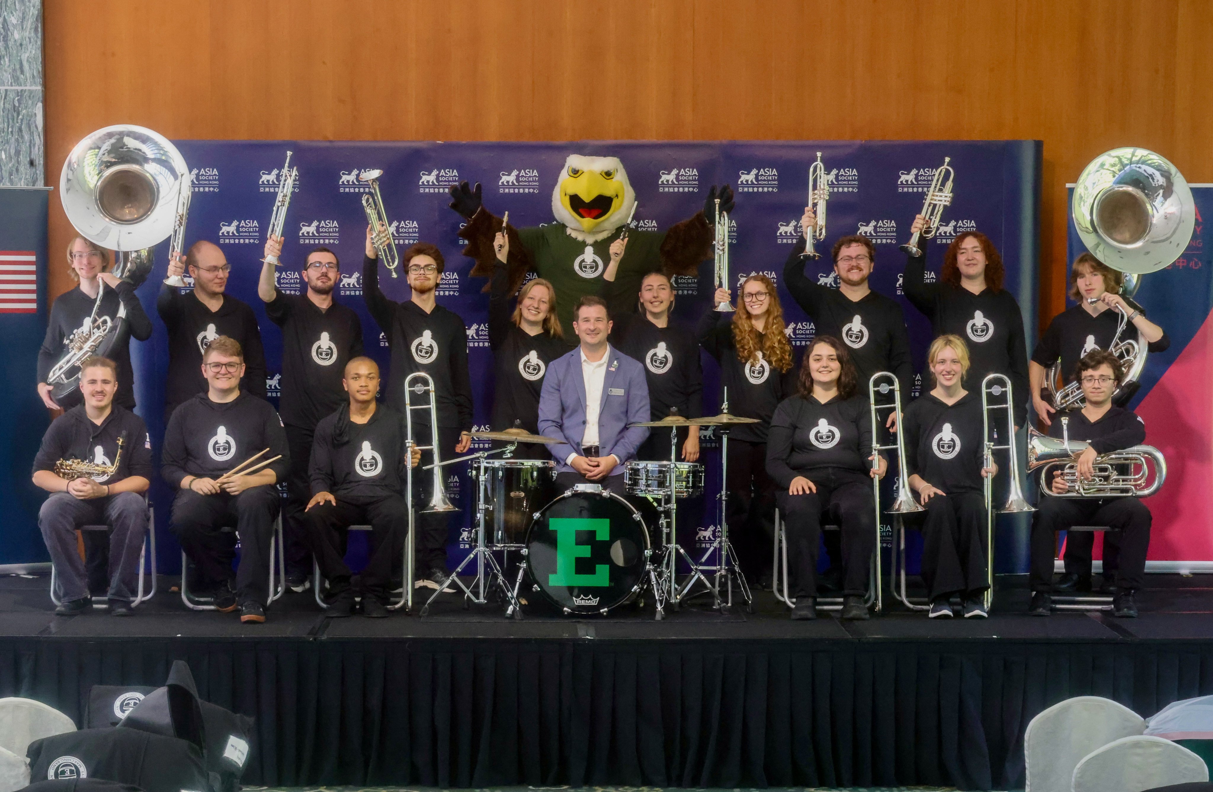 Nick Smith (centre), associate director of bands for the School of Music and Dance at Eastern Michigan University, poses with members of the marching band and the university’s mascot at Asia Society Hong Kong. Photo: Jonathan Wong