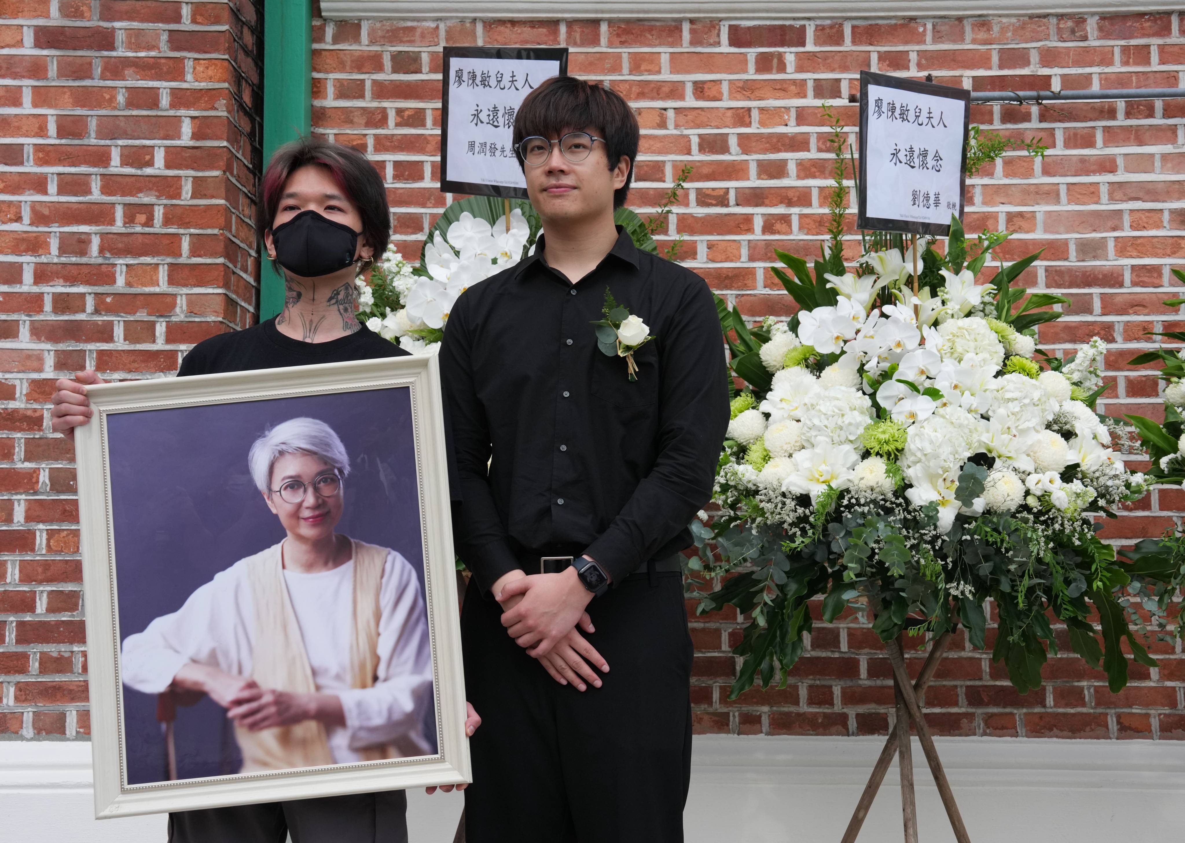 Hong Kong actress Barbara Chan's two sons, Liu Man-chit (left) and John Liu, pose with a portrait of their mother after her funeral at St Andrew’s Church in Tsim Sha Tsui. Photo: Jelly Tse