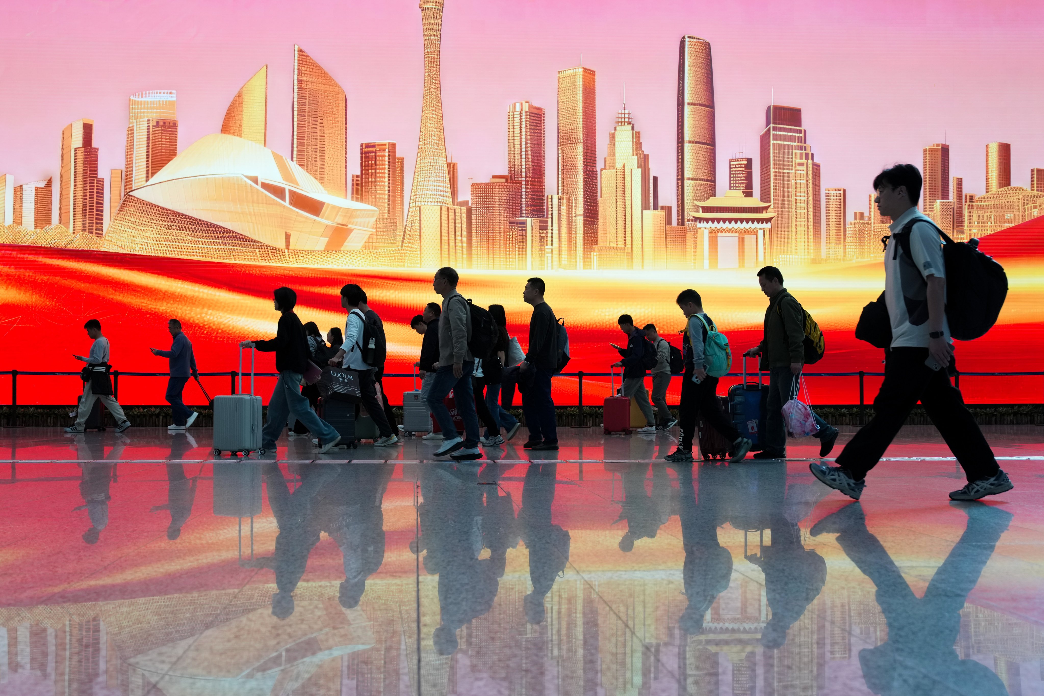 Passengers walk out of the arrivals hall of the Guangzhou Baiyun International Airport in Guangdong province. Photo: Xinhua