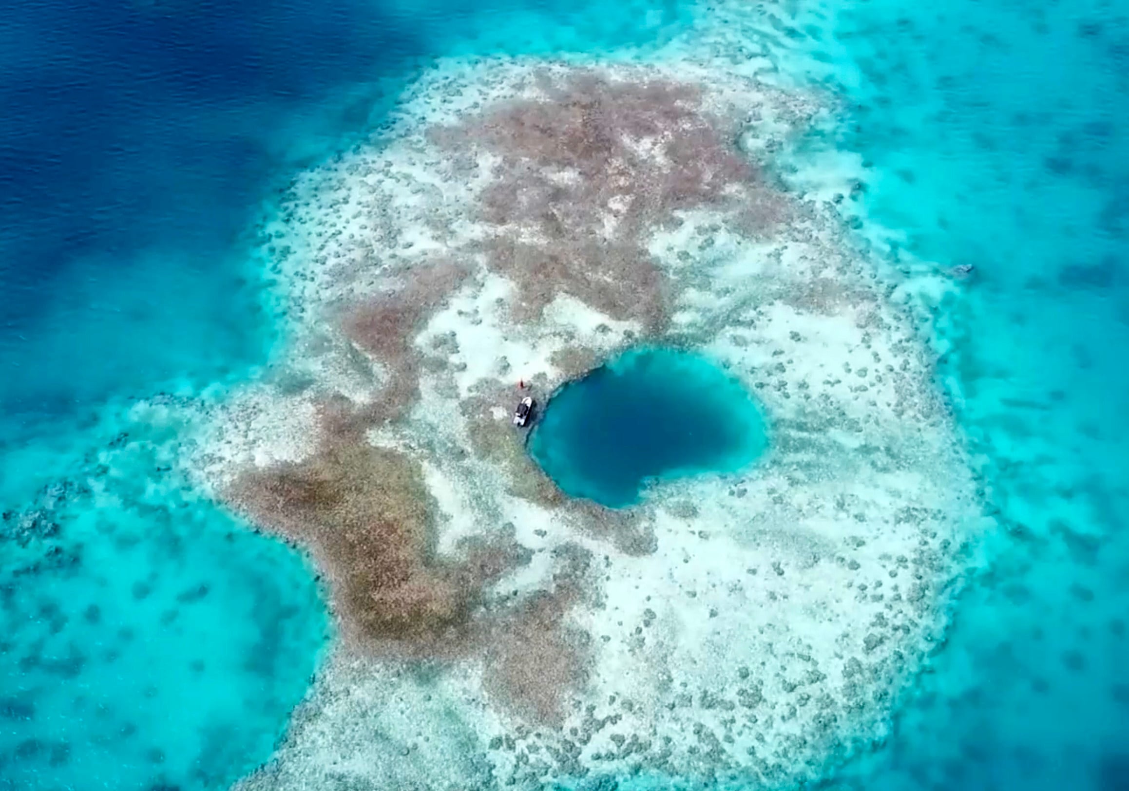 Unlike most of the world’s blue holes – which were once caves on land – the newly discovered blue hole within the Scarborough Shoal was formed by a coral reef. Photo: Ministry of Ecology and Environment
