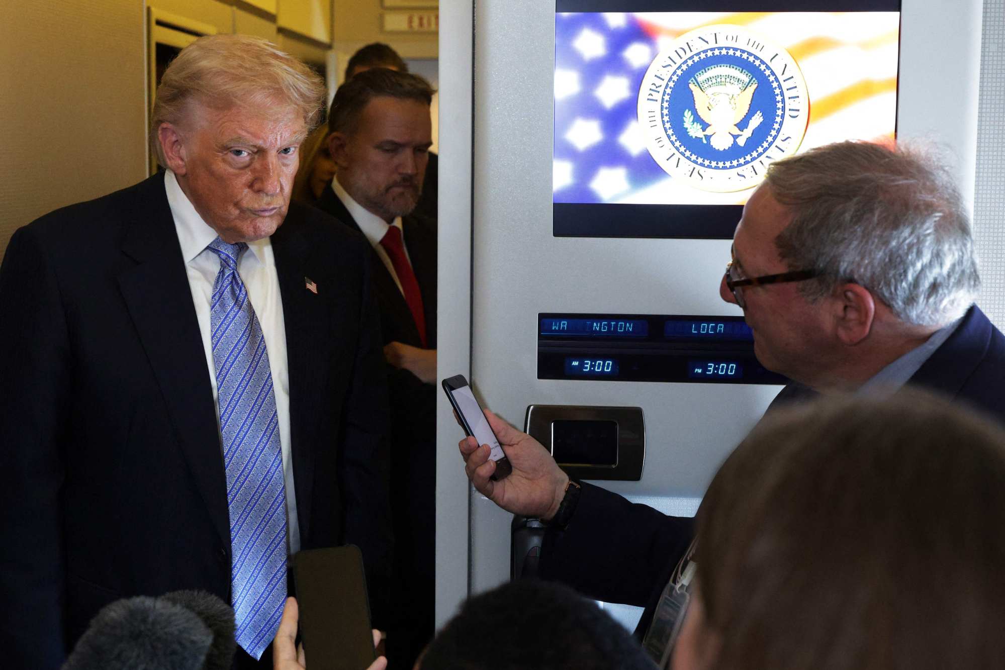 US President Donald Trump speaks to reporters aboard Air Force One on Friday, May 15, after wrapping up his Beijing summit with Xi Jinping, where Taiwan emerged as a key point of tension. Photo: Getty Images