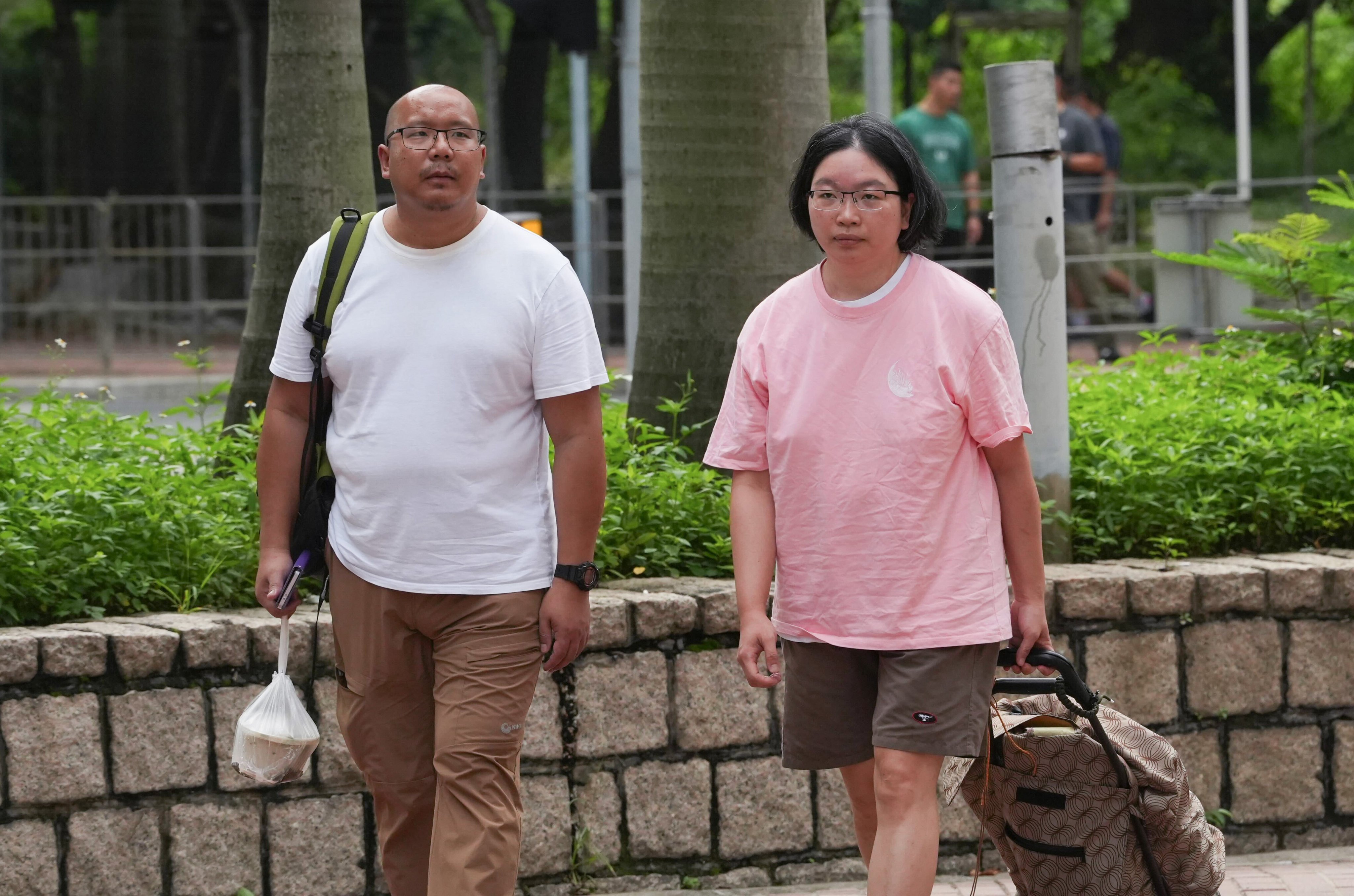 Tsang Wai-bong, left, and Kwan Pui-sin, parents of Danny, arrive at the West Kowloon Juvenile Court for a hearing on Friday. Photo: Sun Yeung