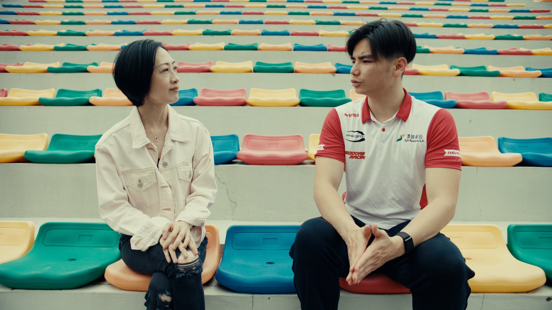 Betty Fung (left), a French cuisine and pastry chef, and Macau racing driver Charles Leong discuss the relationship between sports and food at the city’s Coloane Karting Track.