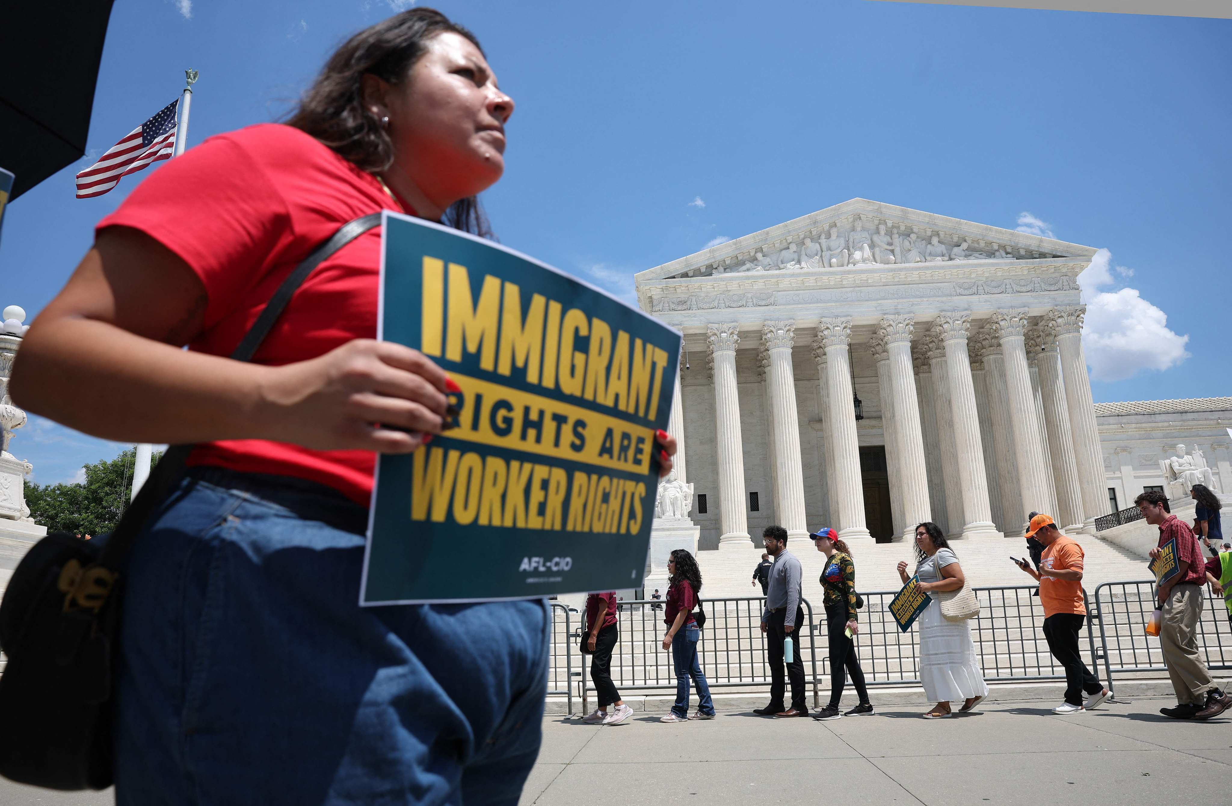 Immigration activists rally against the US Supreme Court’s ruling on temporary protective status in Washington on Thursday. Photo:  AFP