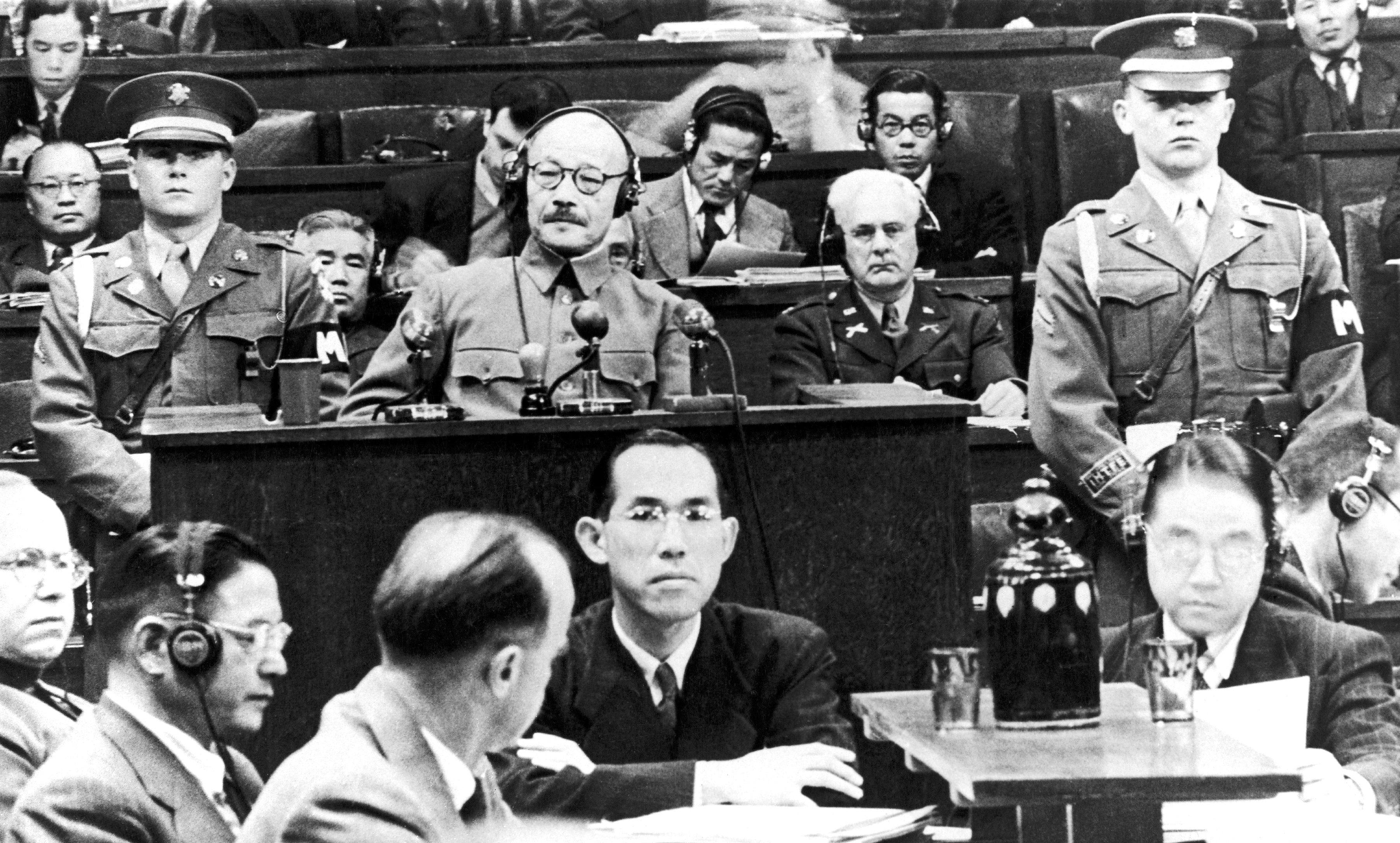 Former general and Japanese prime minister Hideki Tojo is surrounded by members of the military court in Tokyo during his trial on January 19, 1948. Photo: Gamma-Keystone via Getty Images
