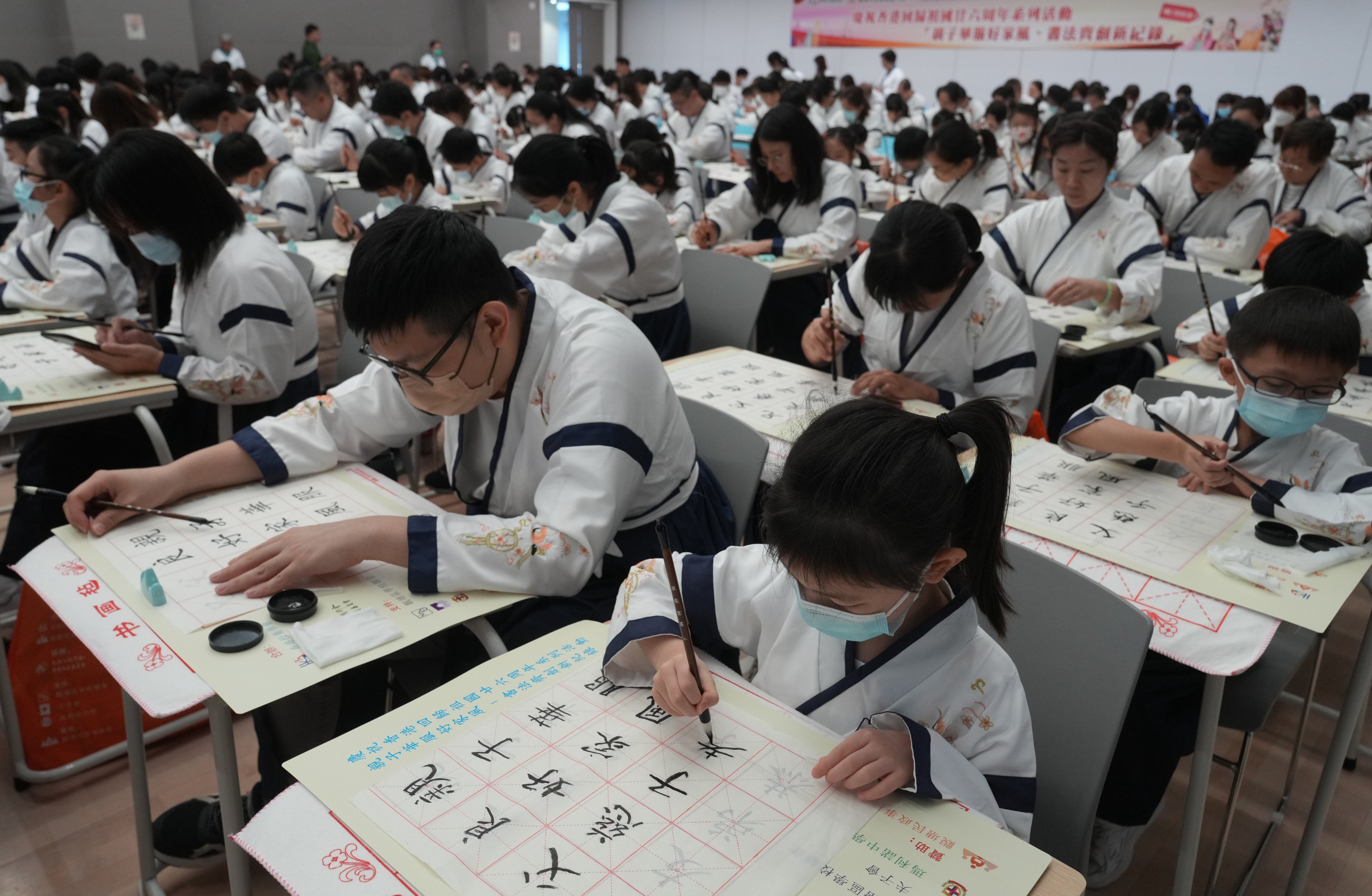 The Hong Kong Academy of School Managers holds an event on traditional Chinese costume and calligraphy at Maryknoll Secondary School in Sau Mau Ping on July 9, 2023. Some of the most significant changes in the Chinese language shaped by foreign influences have occurred not in vocabulary but in the grammar and sentence structures that shape how Chinese is written and spoken. Photo: Sam Tsang