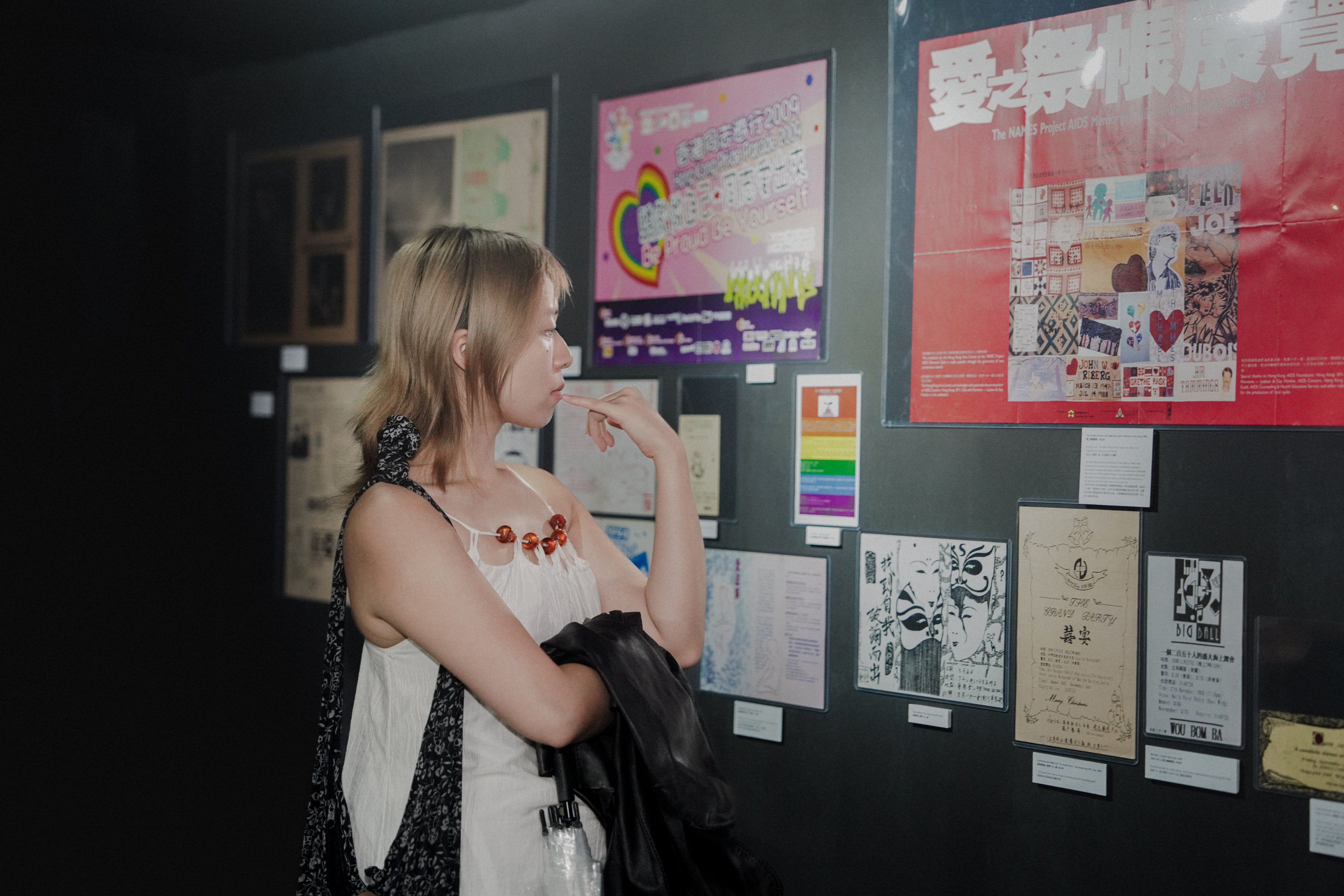 A visitor browses exhibits at “Offline Memories: Hong Kong LGBTQ+ Archive of Printed Matter from the Pre-Internet Era” at Eaton HK’s Tomorrow Maybe art space.