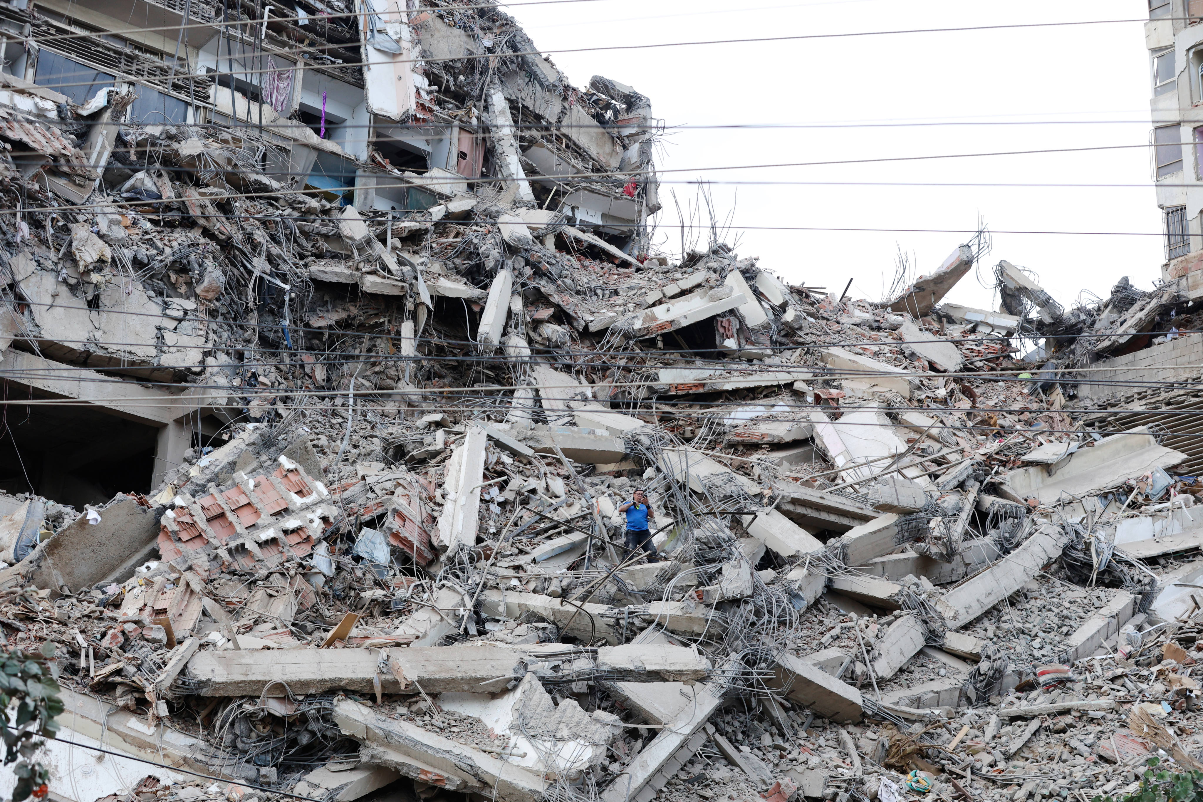 A man walks among the rubble of a building in La Guaira, Venezuela. Photo: AP