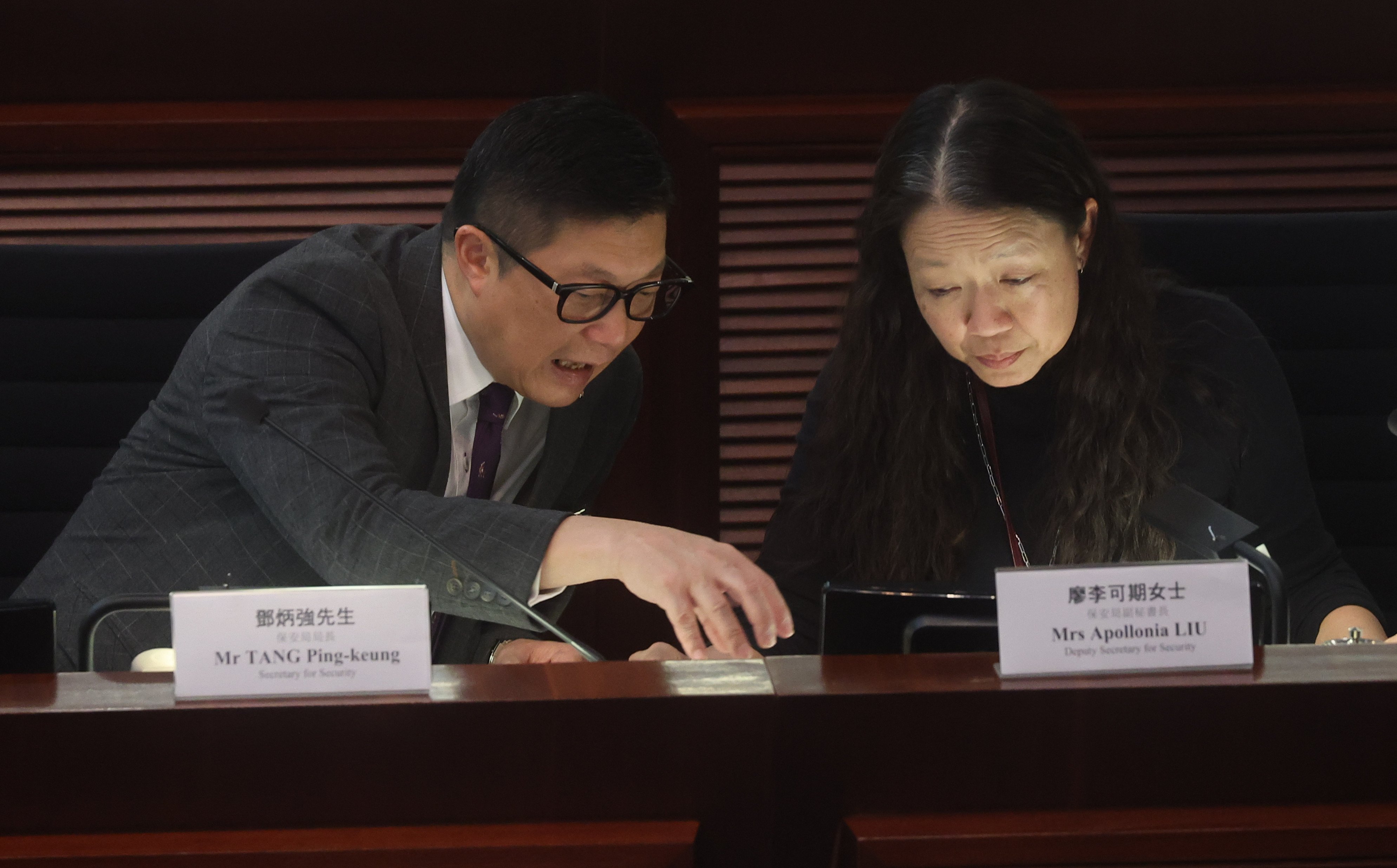 Secretary for Security Chris Tang Ping-keung and deputy secretary Apollonia Liu at Legco. She rose from directorate pay scale point four to eight, the highest ranking, within two years. Photo: Edmond So