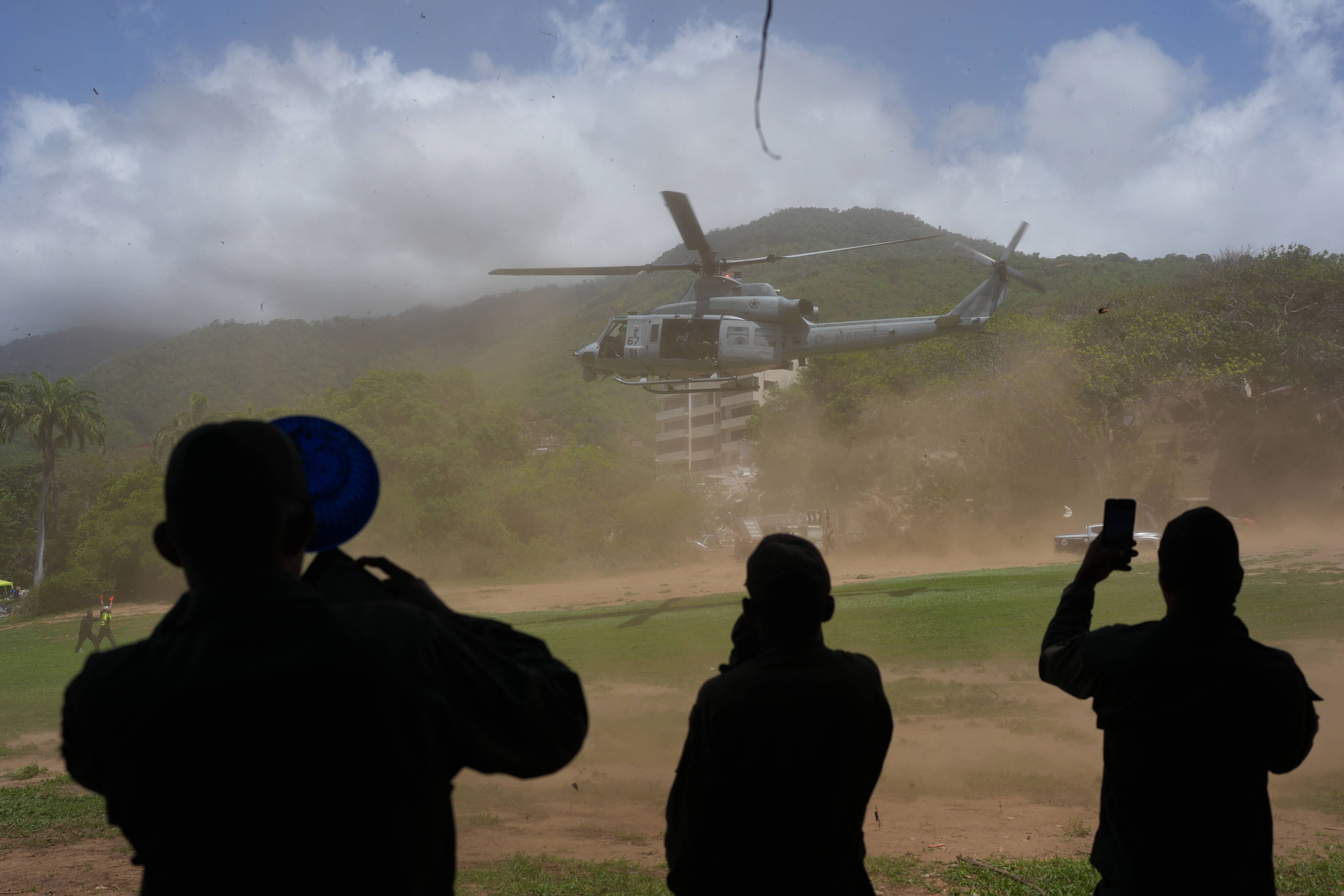 A US military helicopter takes off after delivering humanitarian aid in La Guaira, Venezuela, on Saturday. Photo: AP