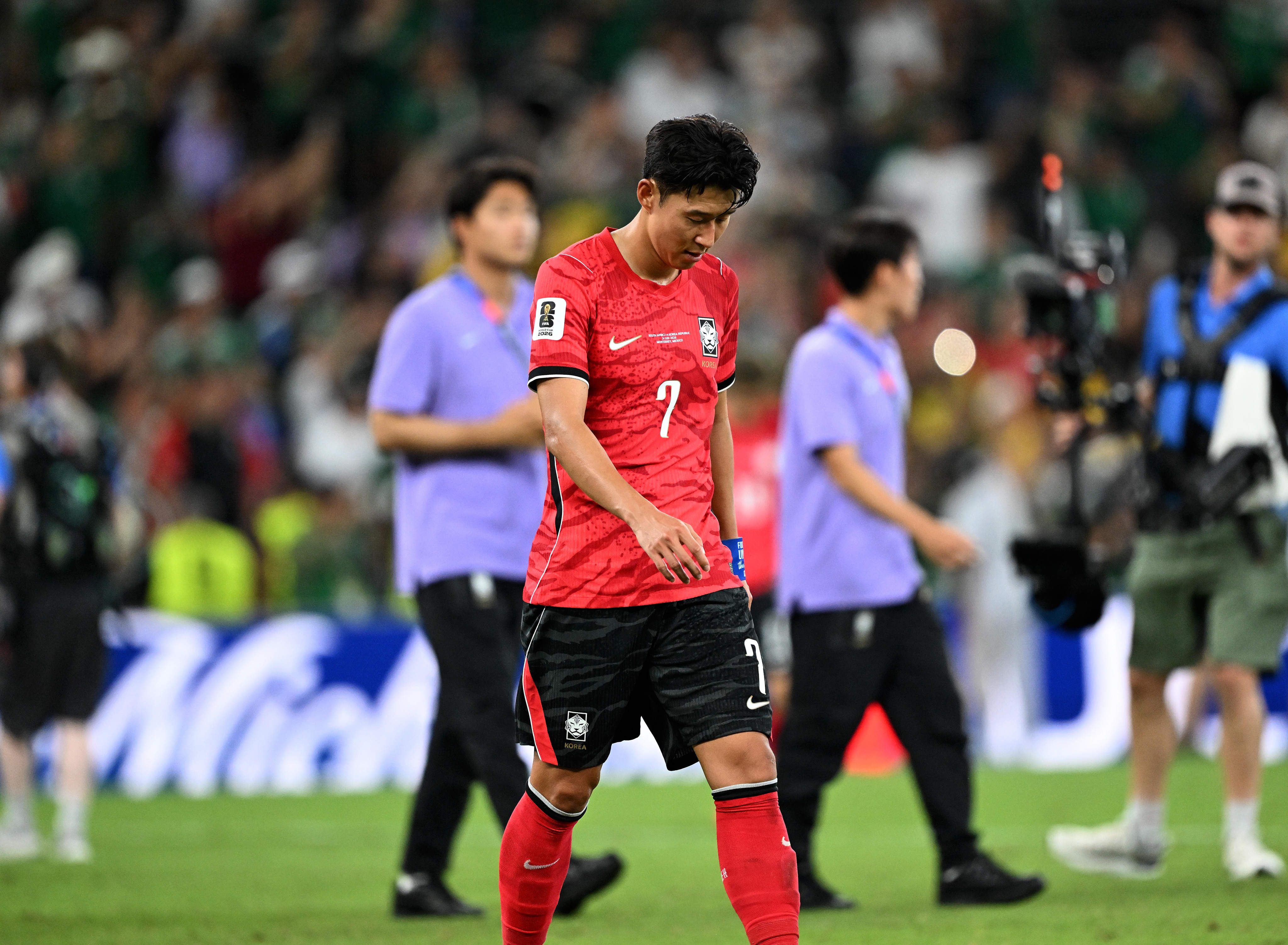 South Korea’s Son Heung-min leaves the field with his head bowed after his side’s loss to South Africa. Photo: Xinhua