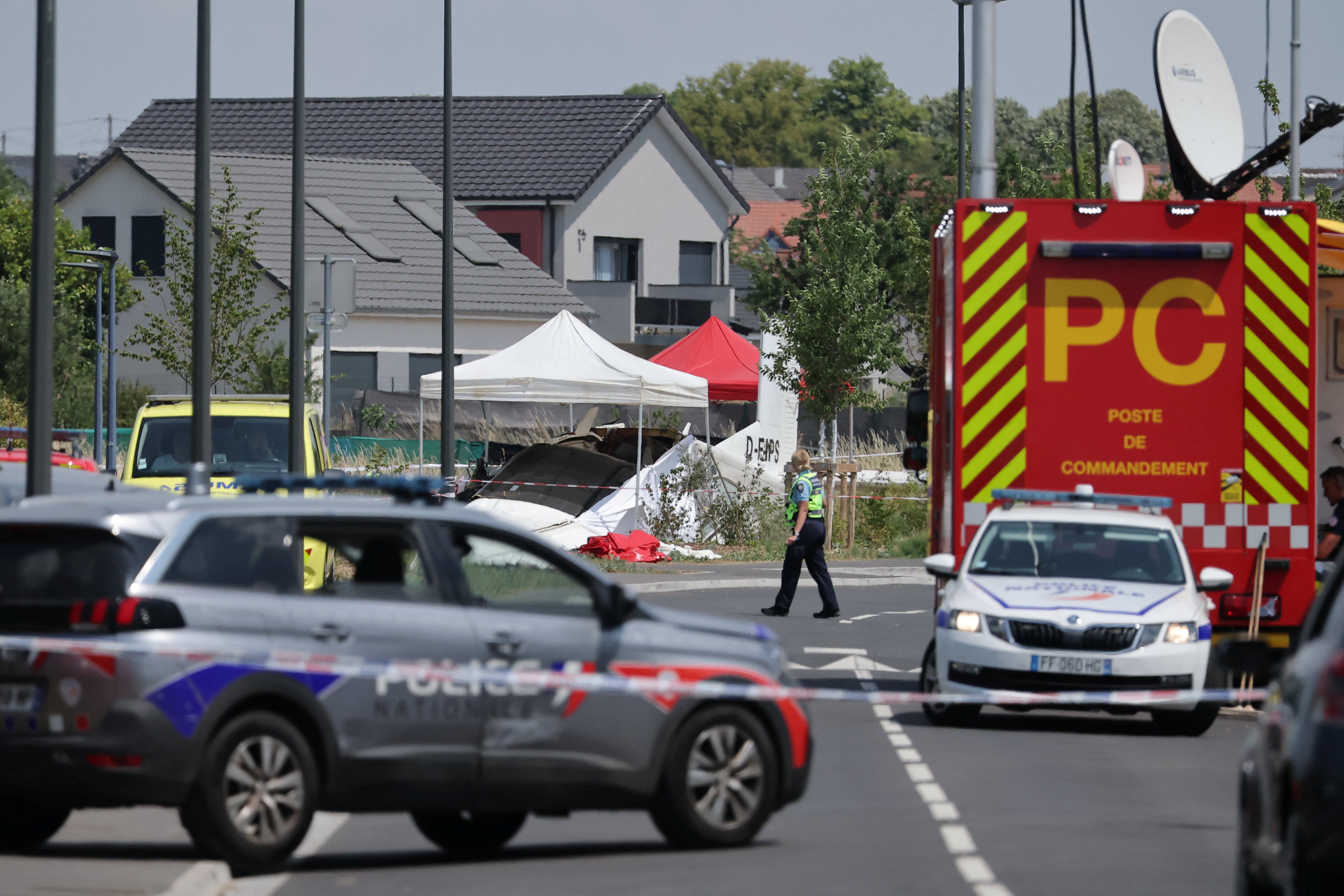 A rescuer works at the site of a plane crash in Tomblaine, France on Sunday. Photo: Reuters
