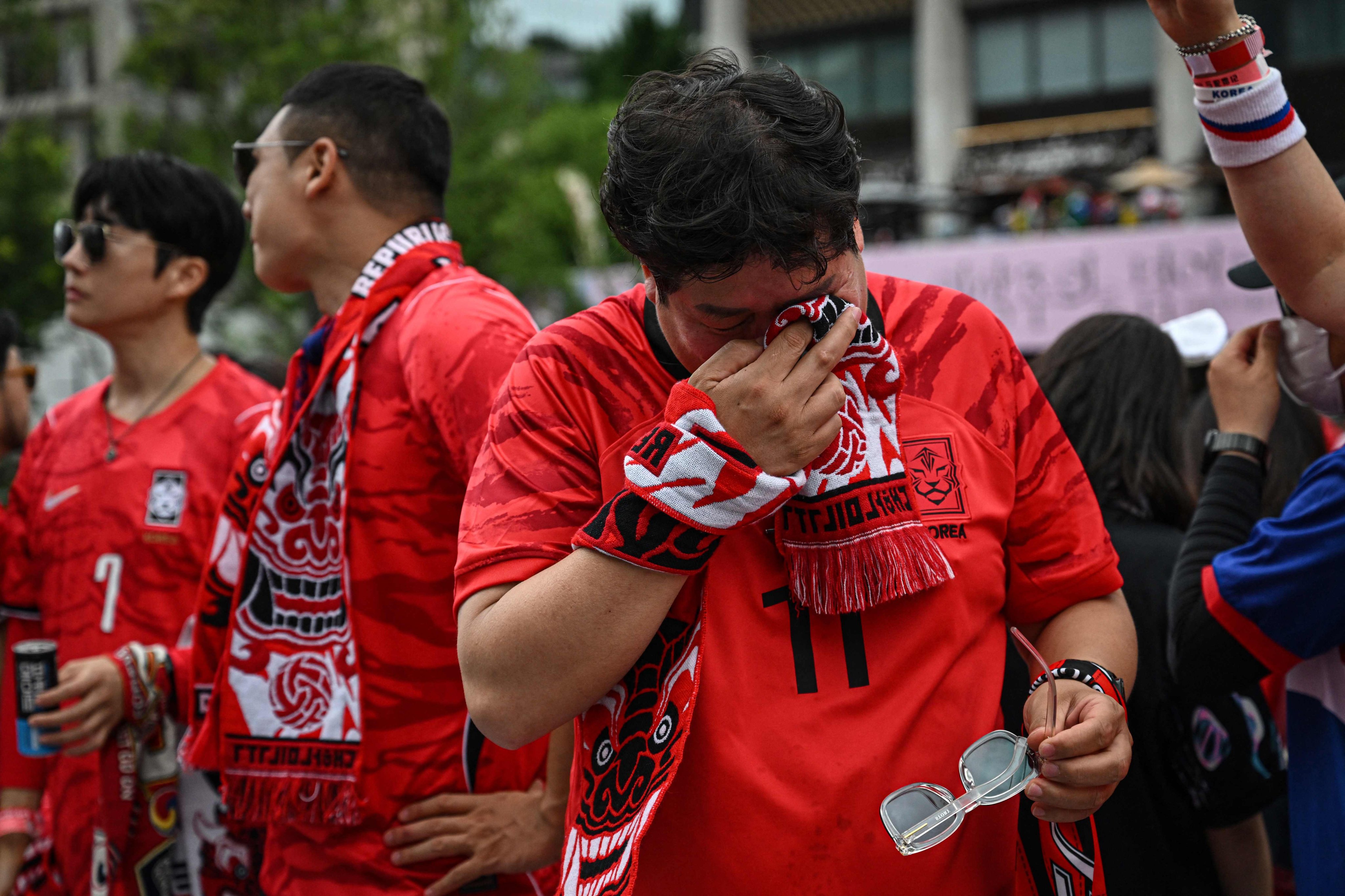 South Korean fans react after their team lost the 2026 World Cup football match against South Africa at Gwanghwamun Square in Seoul last week. Photo: AFP