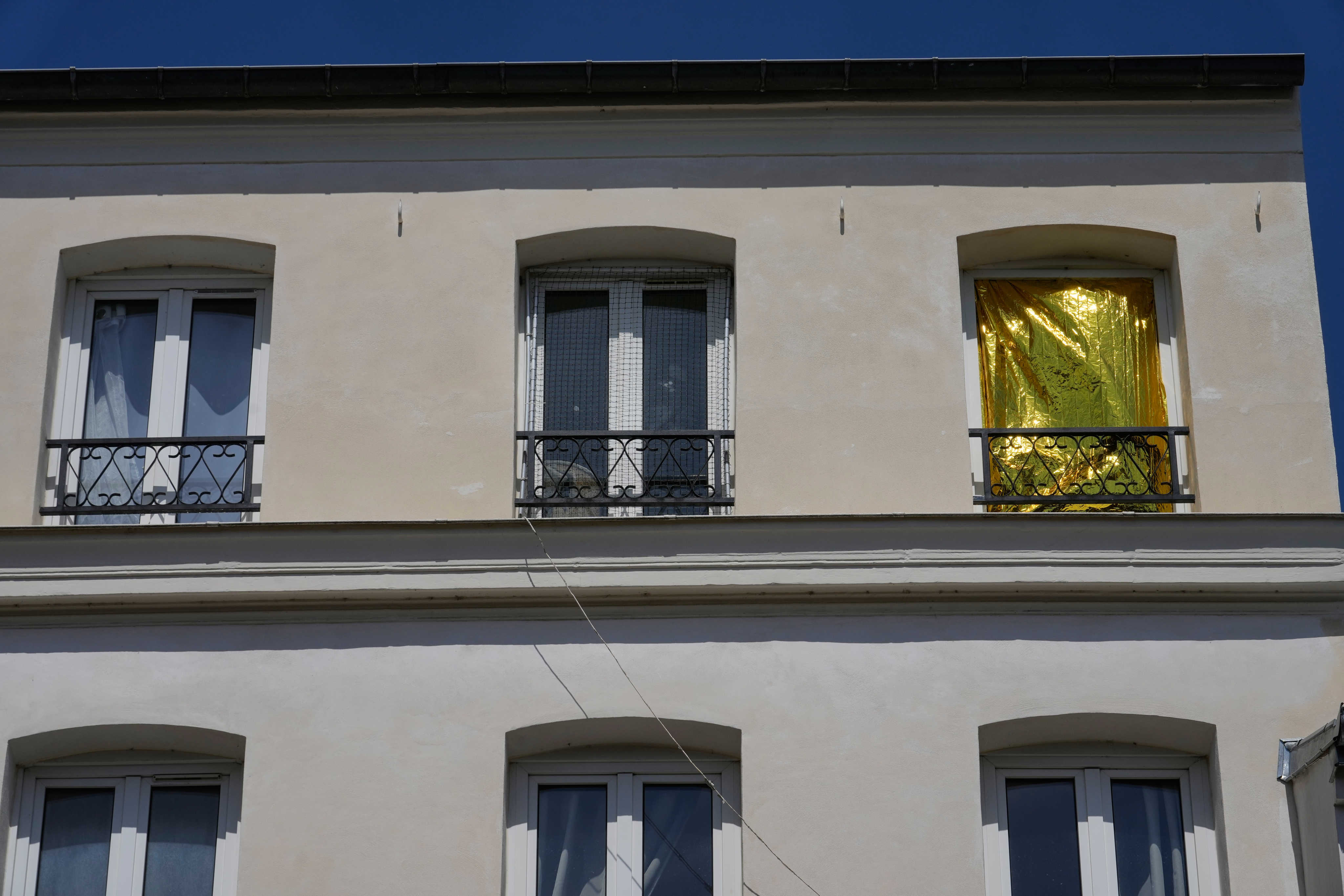 A thermal blanket covers a window to help keep out the heat in Saint-Germain-en-Laye, west of Paris. Photo: AP