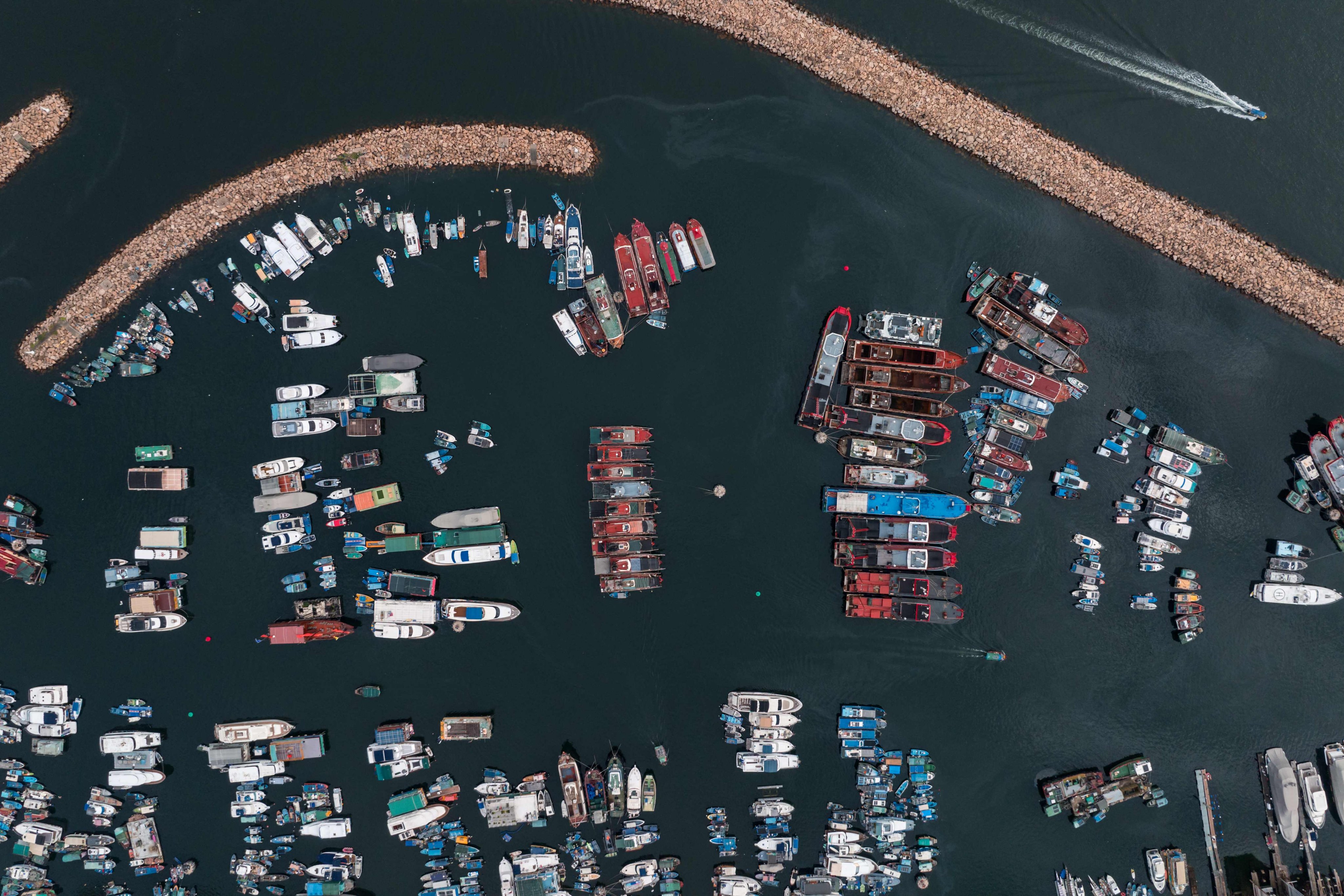 Boats are moored at a typhoon shelter in Hong Kong on June 10. The Hong Kong and Beijing governments would do well to remember that merely being reliable is a most potent competitive advantage. Photo: AFP