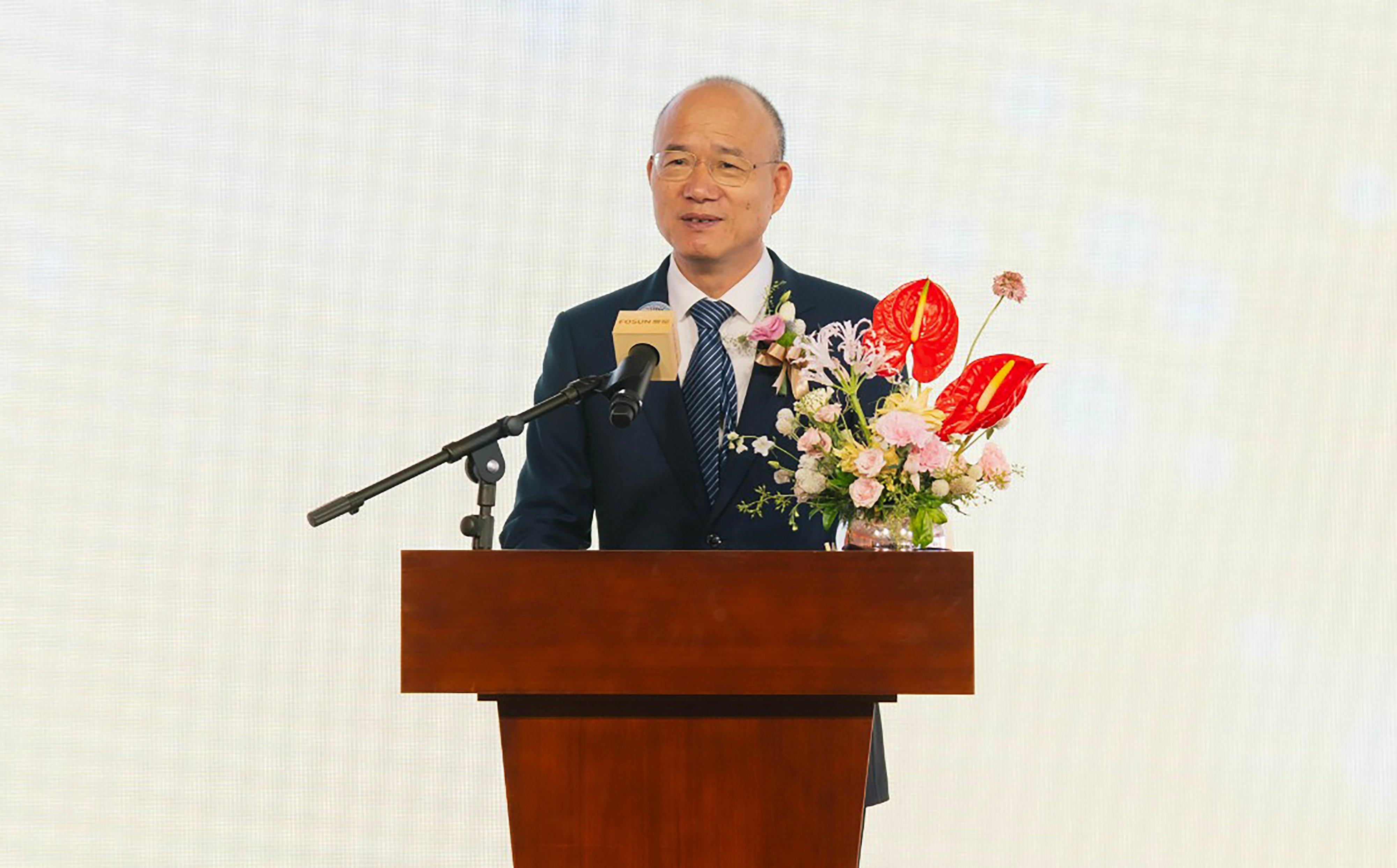 Fosun International chairman Guo Guangchang speaks Monday at the groundbreaking ceremony of a HK$10 billion residential project at the site of the Shaw Brothers studio in Clear Water Bay. Photo: Fosun