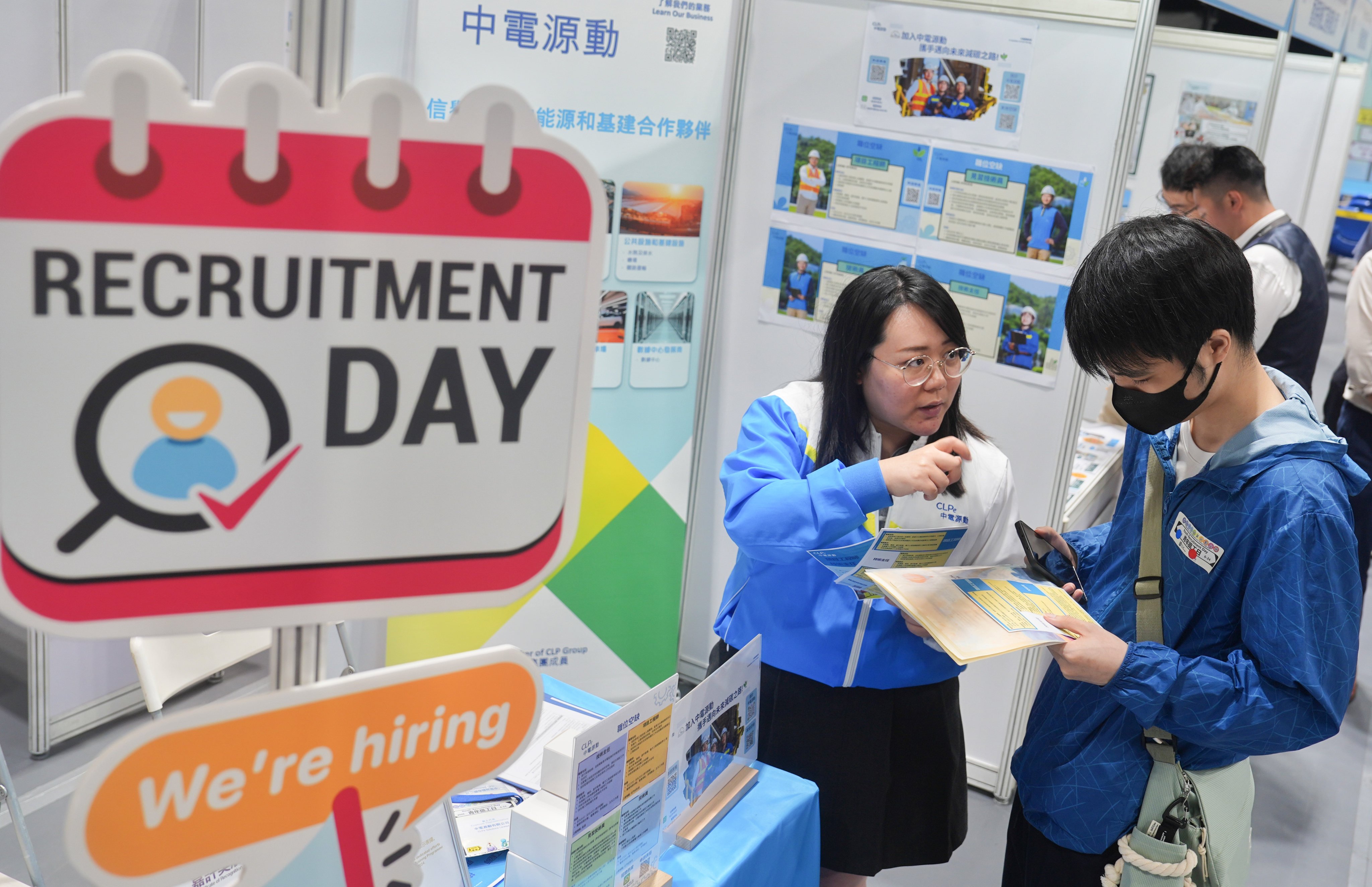 Jobseekers browse through information at a youth recruitment day organised by the Labour Department on June 24. Photo: Elson Li