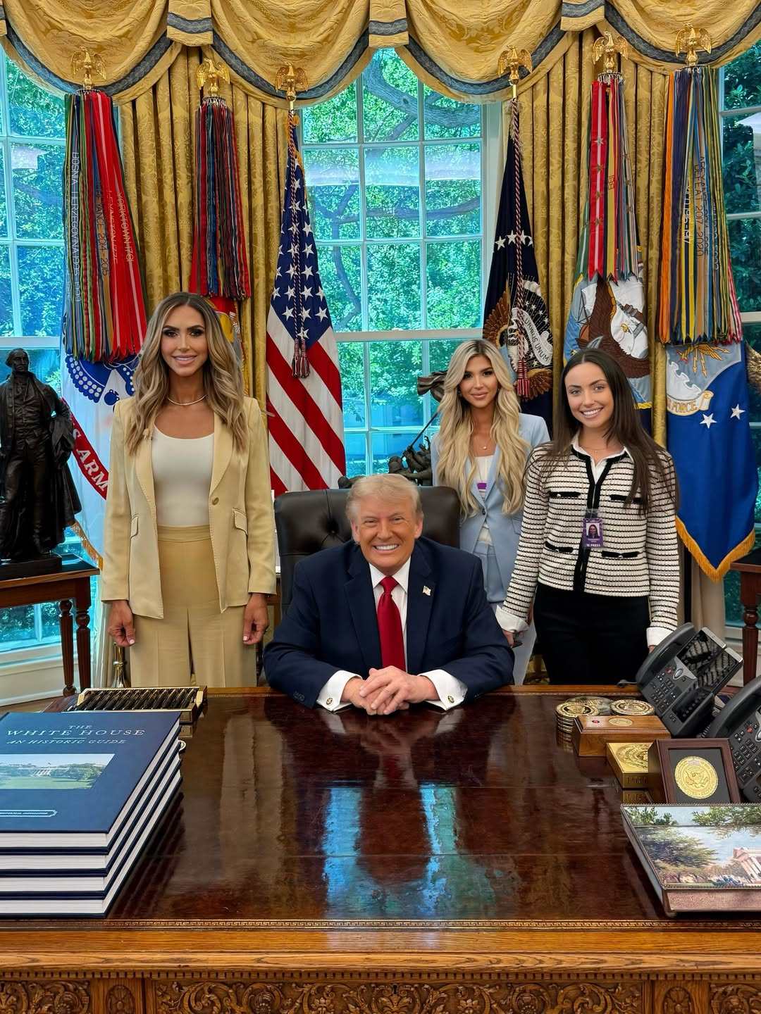 Adrienne Gray with Lara Trump, Donald Trump and Grace Taggart. Photo: @adriennegraytv/Instagram