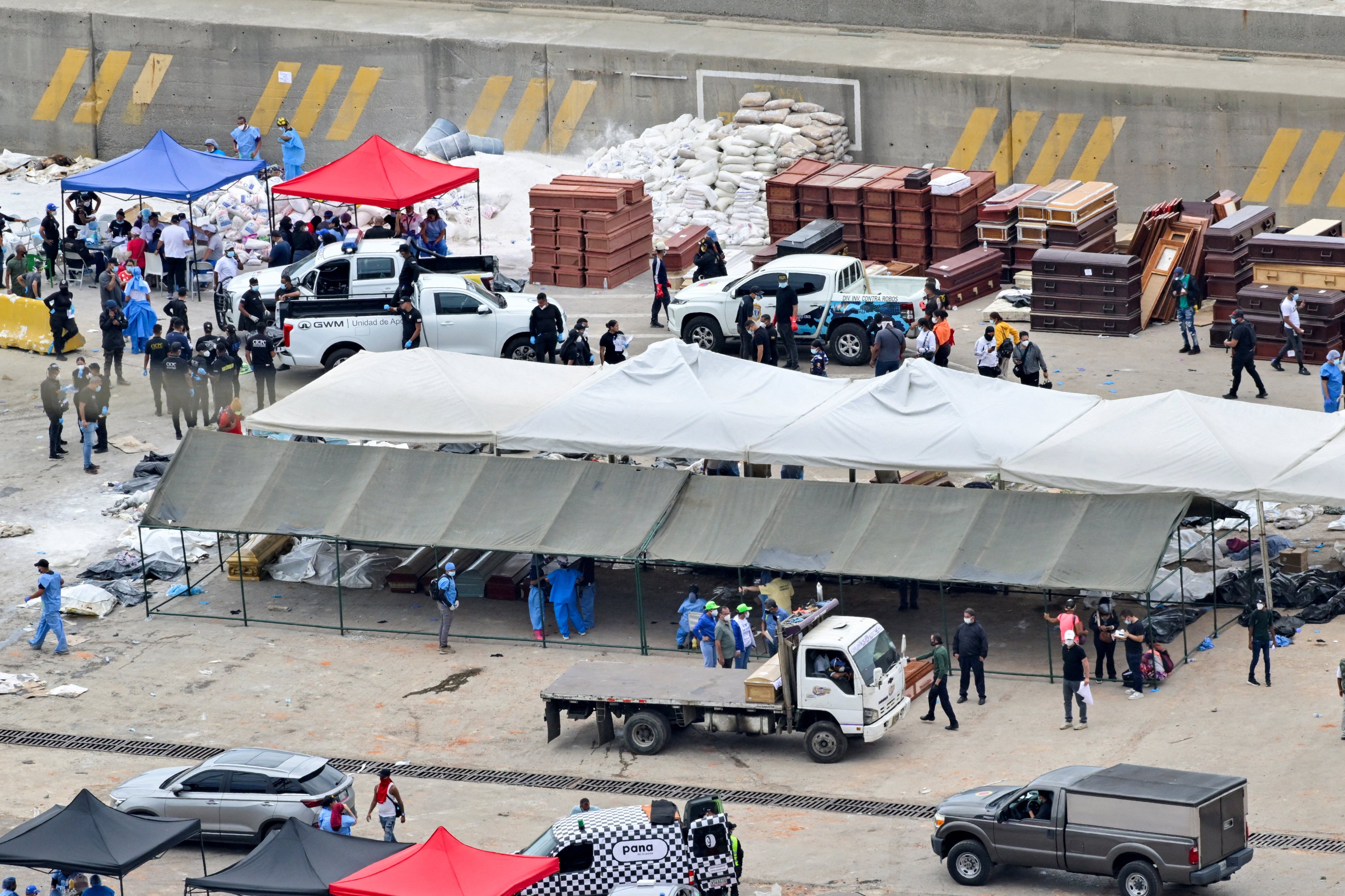Bodybags of victims and coffins. Photo: Reuters