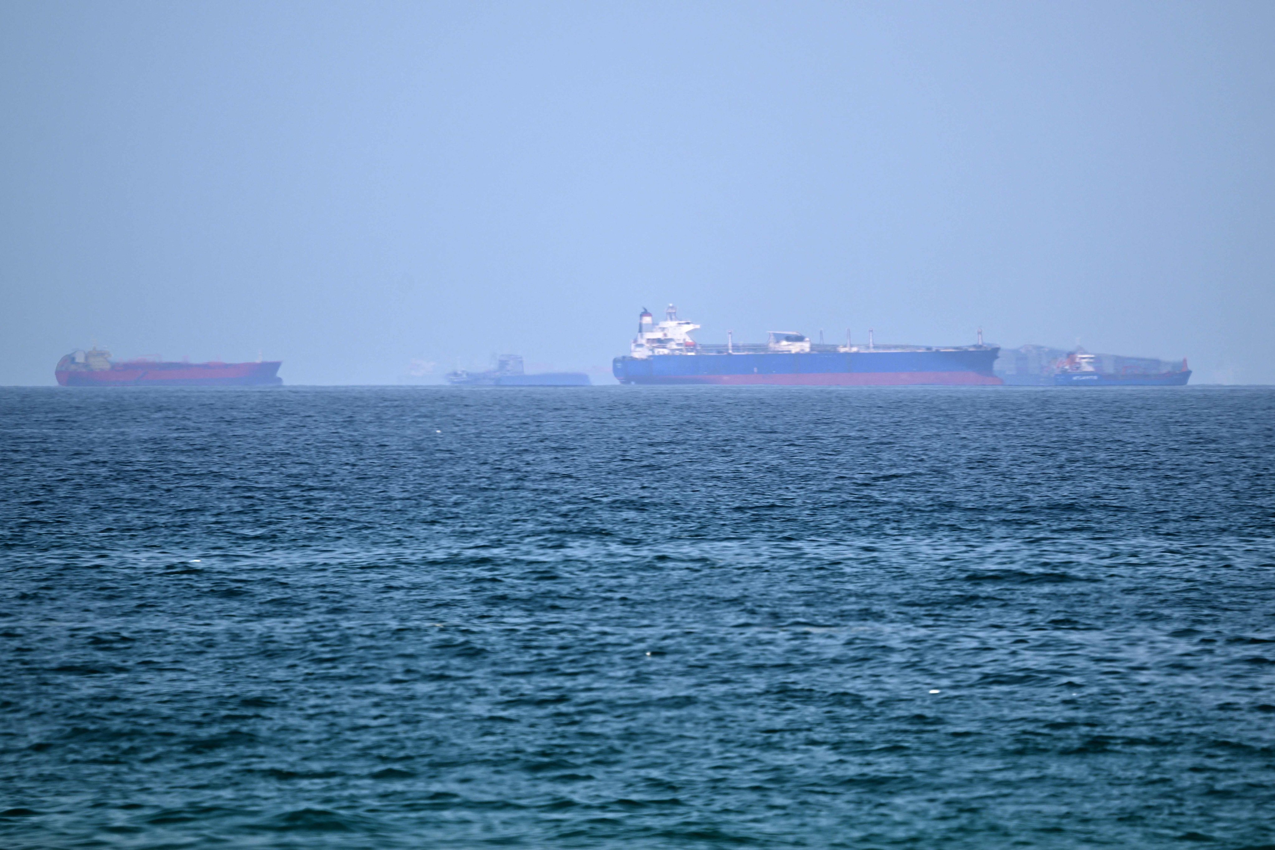 Cargo ships wait off the coast of the Khor Fakkan Container Terminal along the Gulf of Oman. Commercial shipping through the nearby Strait of Hormuz has faced severe disruptions. Photo: AFP