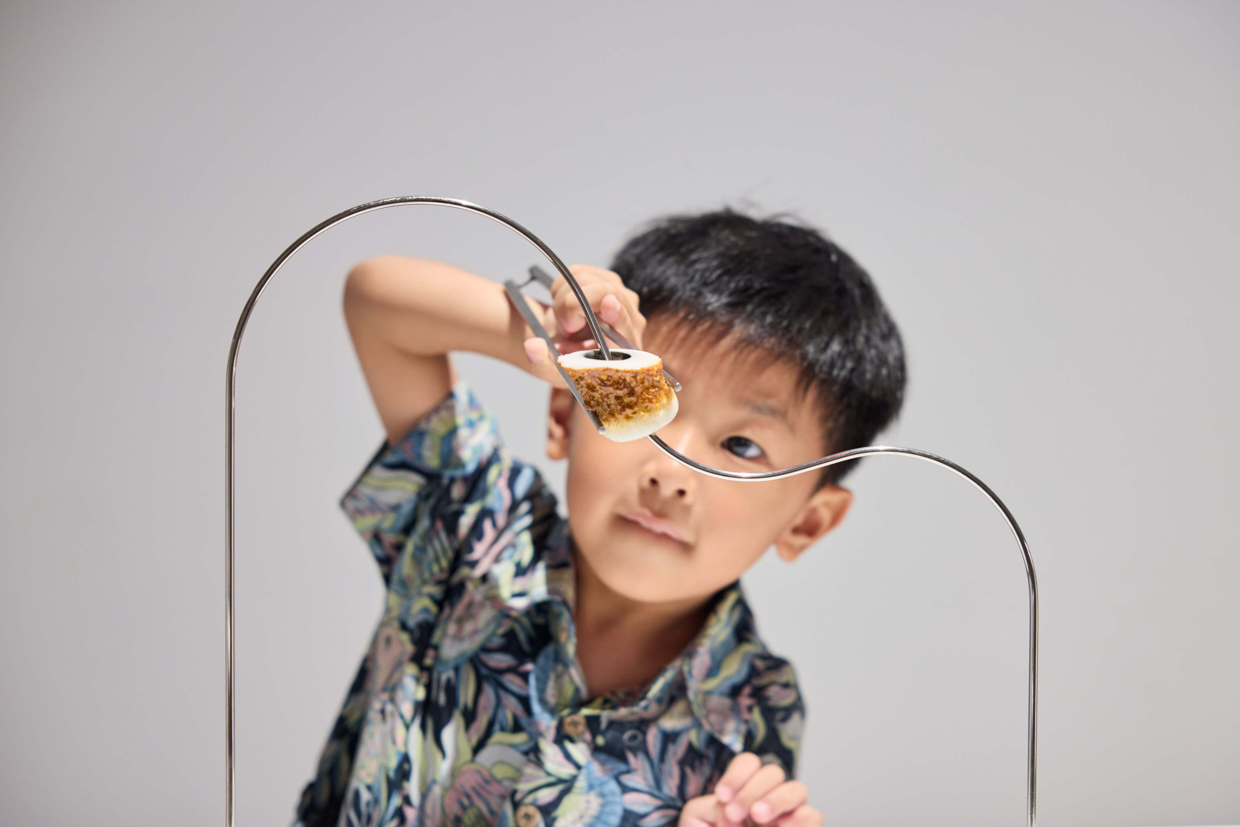 A visitor tries his hand at a challenge at “Design Ah! Experience the Wonder of Everyday Design”, a new exhibition based on a popular Japanese TV series at Hong Kong’s M+ museum. Photo: M+