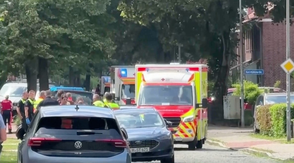 Emergency responders and residents in Stade, Germany, on Monday after five people died in a shooting. Photo: via AP
