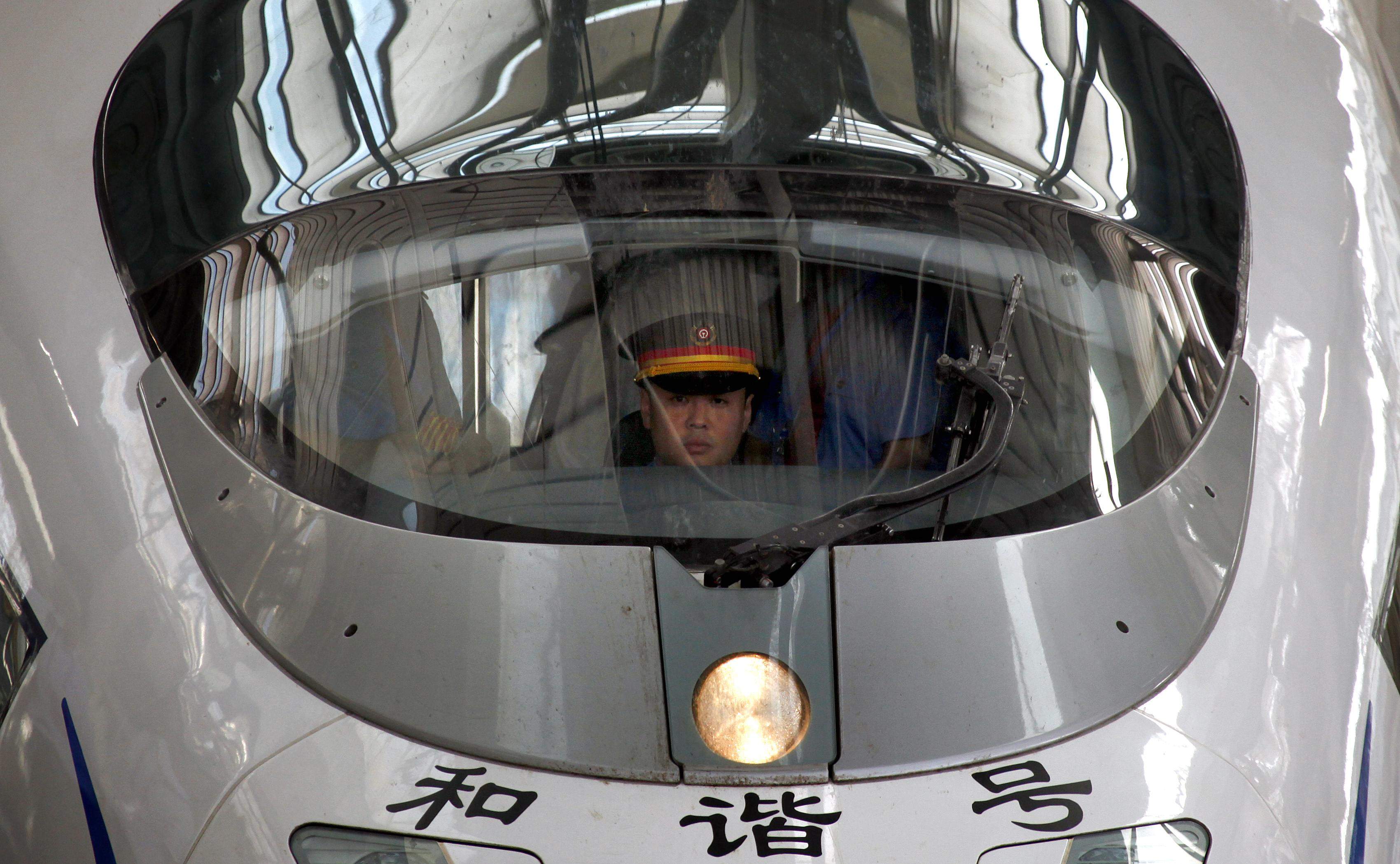A train driver sits in a new high-speed train before it departs from the Beijing-South railway station for Shanghai as part of an official trip for members of the media June 27, 2011. Photo: Reuters