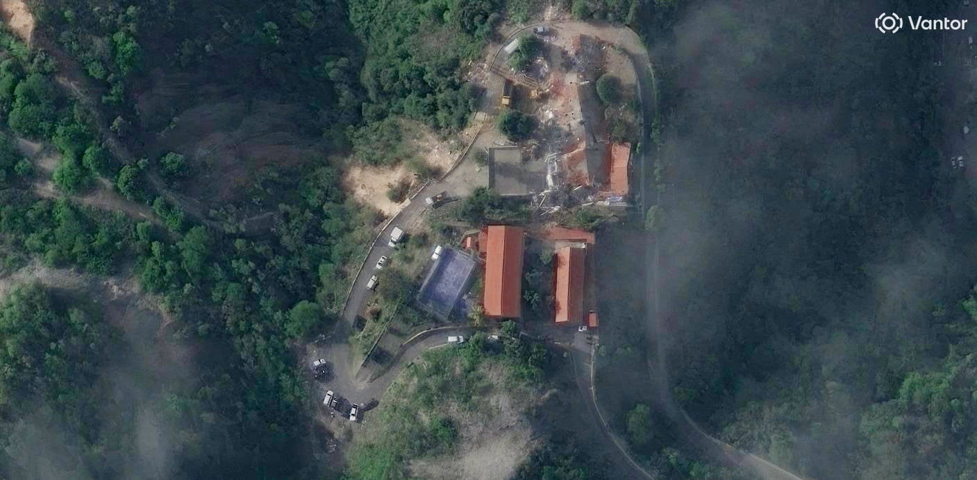 A satellite view captures the extensive structural damage at the Hotel Santuario La Llanada in La Guaira, where more than 100 US deportees had arrived hours earlier. Photo: Vantor via Reuters
