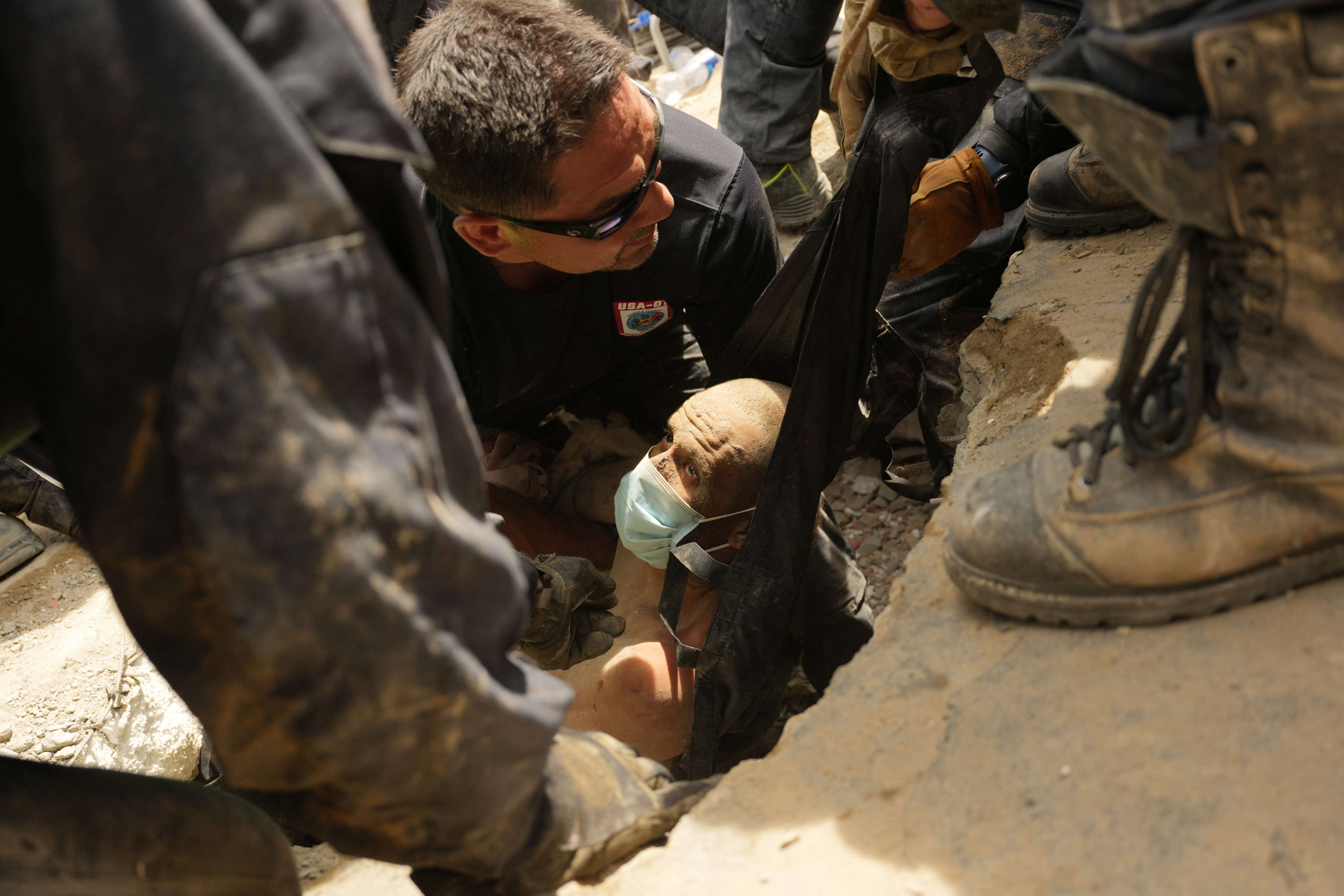 US firefighters on Sunday pulled a survivor from the rubble of a building that collapsed in Wednesday’s earthquakes in La Guaira, Venezuela. Photo: AP