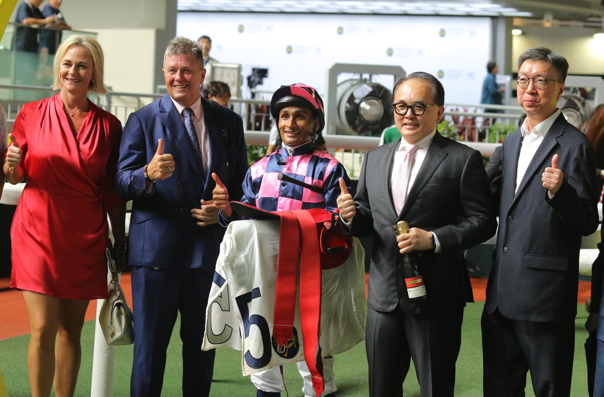 Brett Crawford celebrates the win of Sovereign Fund after securing a double at Sha Tin.
