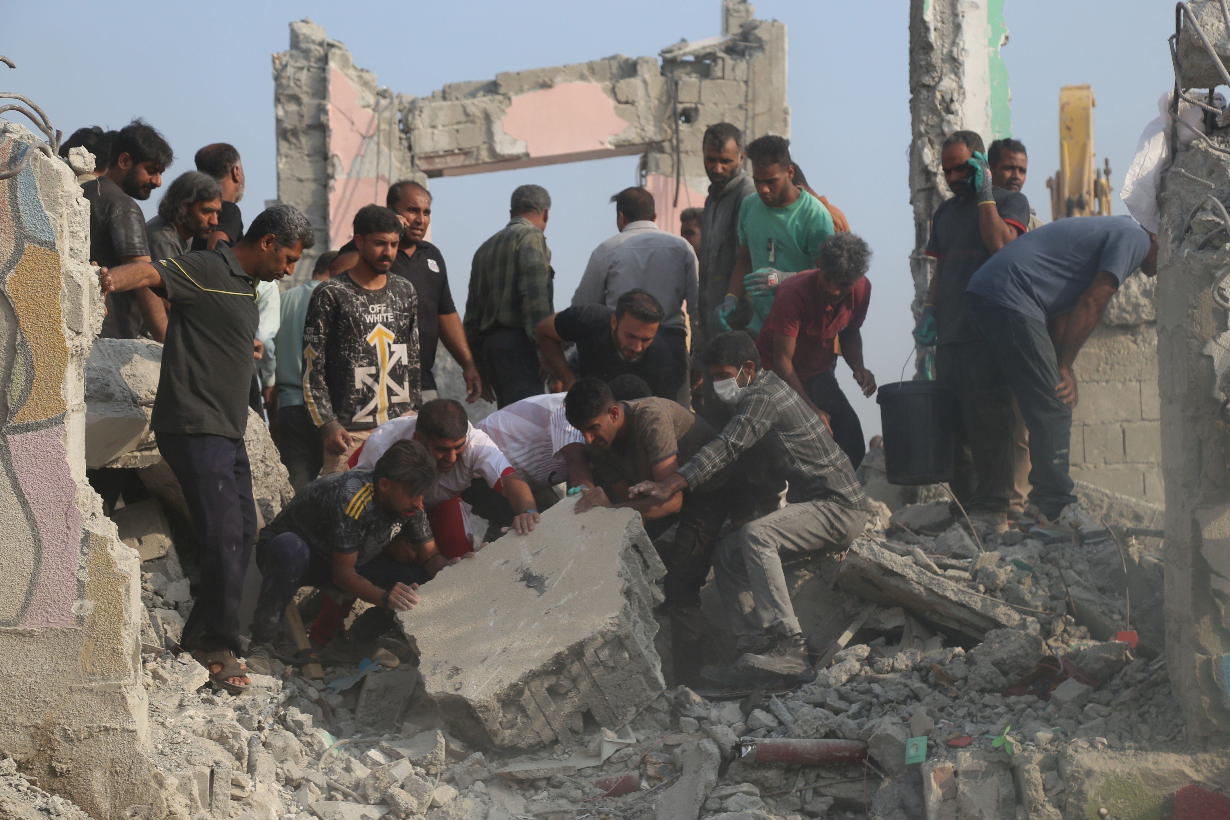 Iranians search through the rubble in the aftermath of the February 28 strike on the school in Minab. Photo: Mehr News Agency via AP