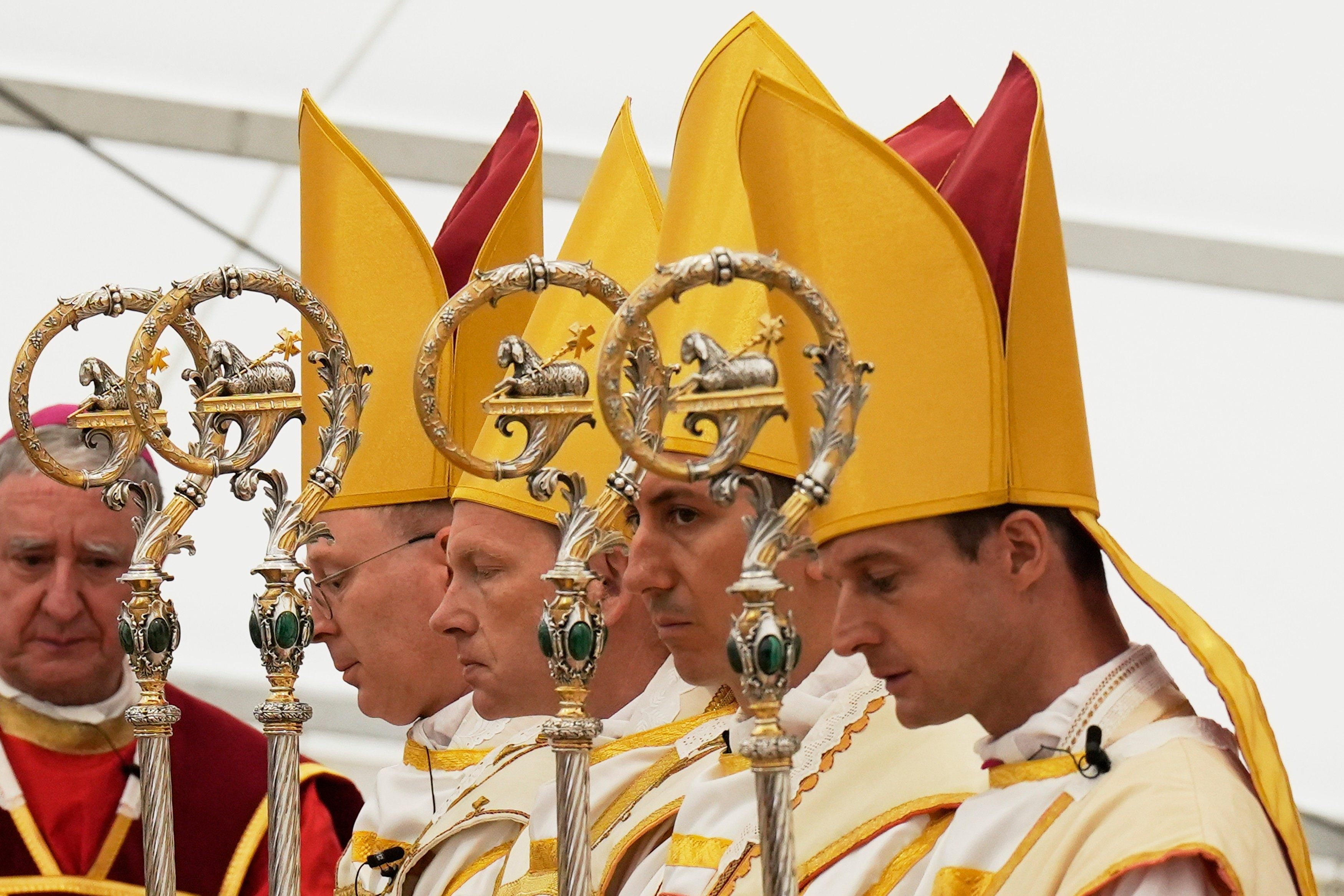 Newly consecrated bishops pray at the end of their consecration ceremony in Switzerland on Wednesday. Photo: AP
