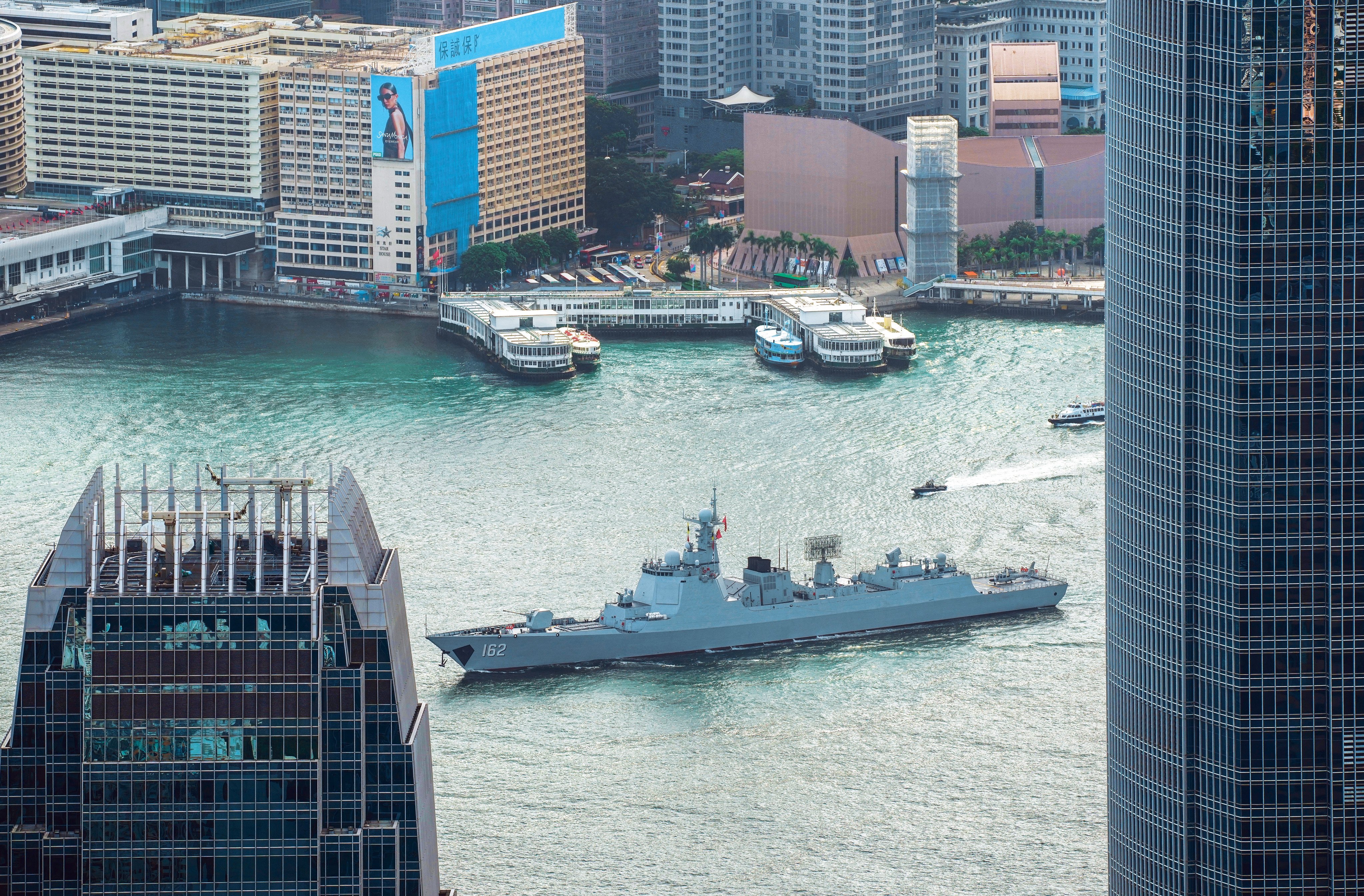 The destroyer Nanning sails through Victoria Harbour at the start of a five-day port call. Photo: Robert Ng