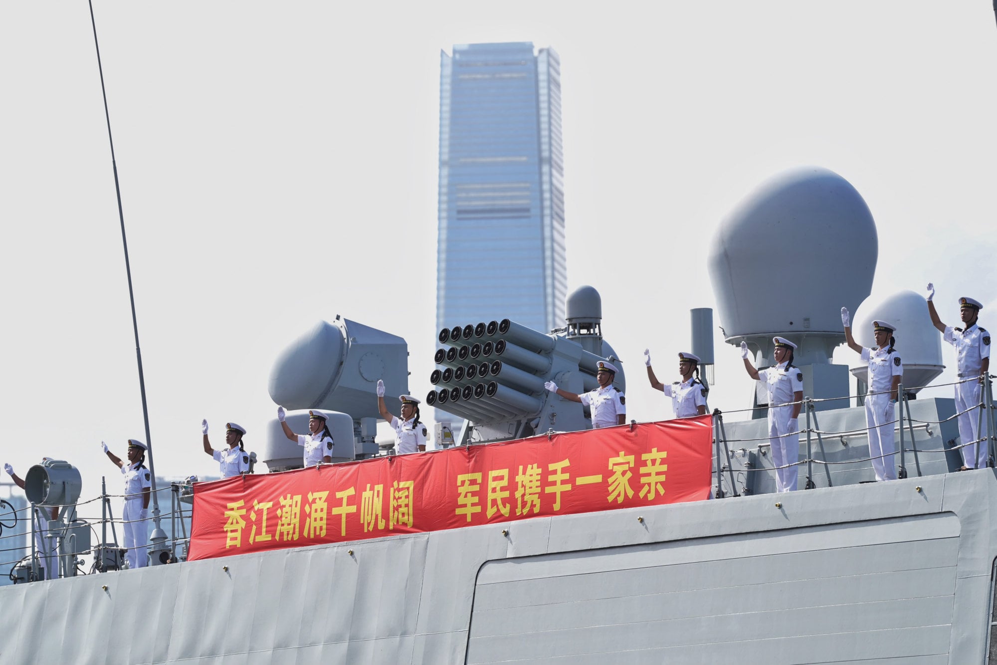 PLA Navy officers wave from the guided-missile frigate Hengyang. Photo: Elson Li