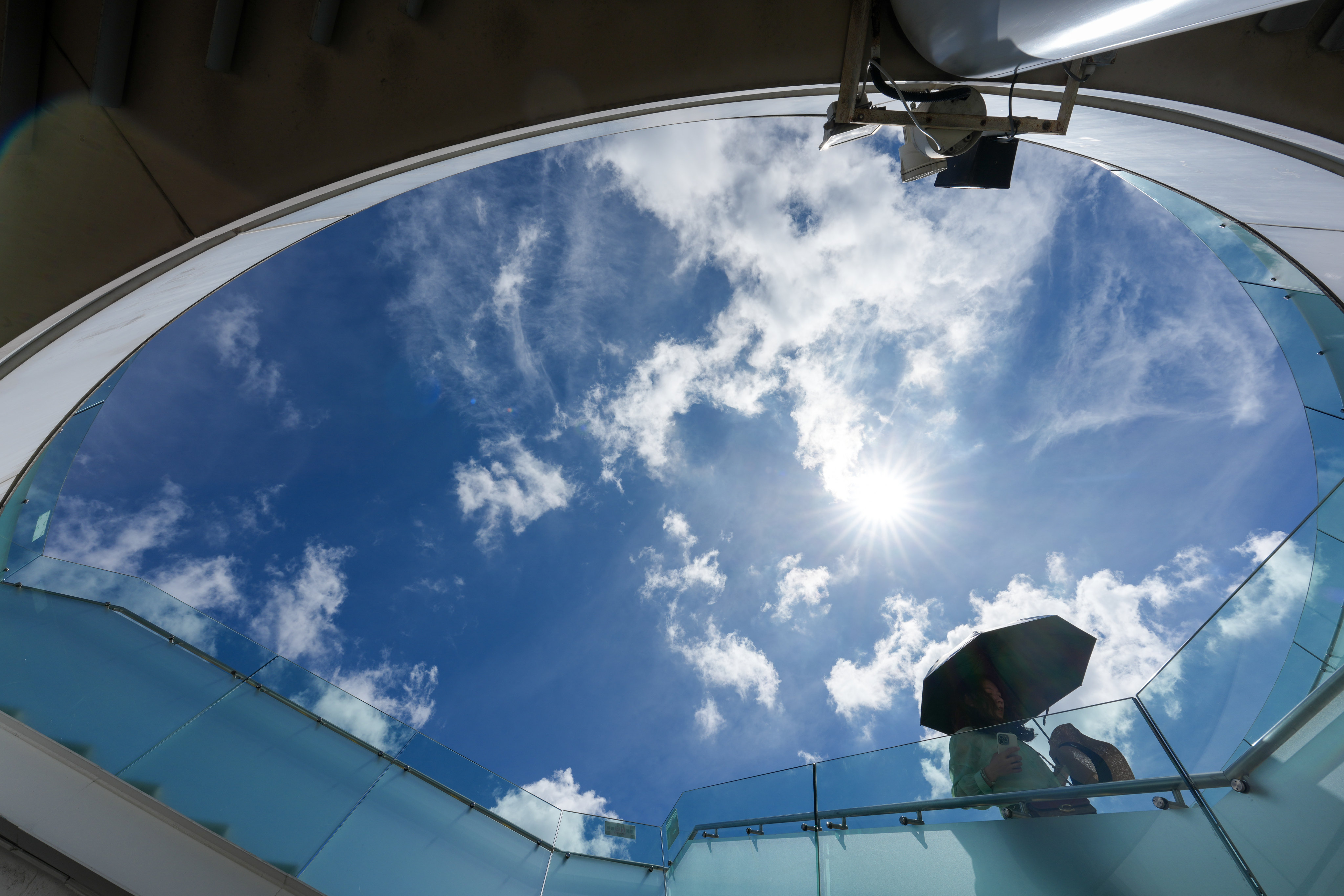 Pedestrians walk under a scorching sun at the Tsim Sha Tsui waterfront. Photo: Jelly Tse