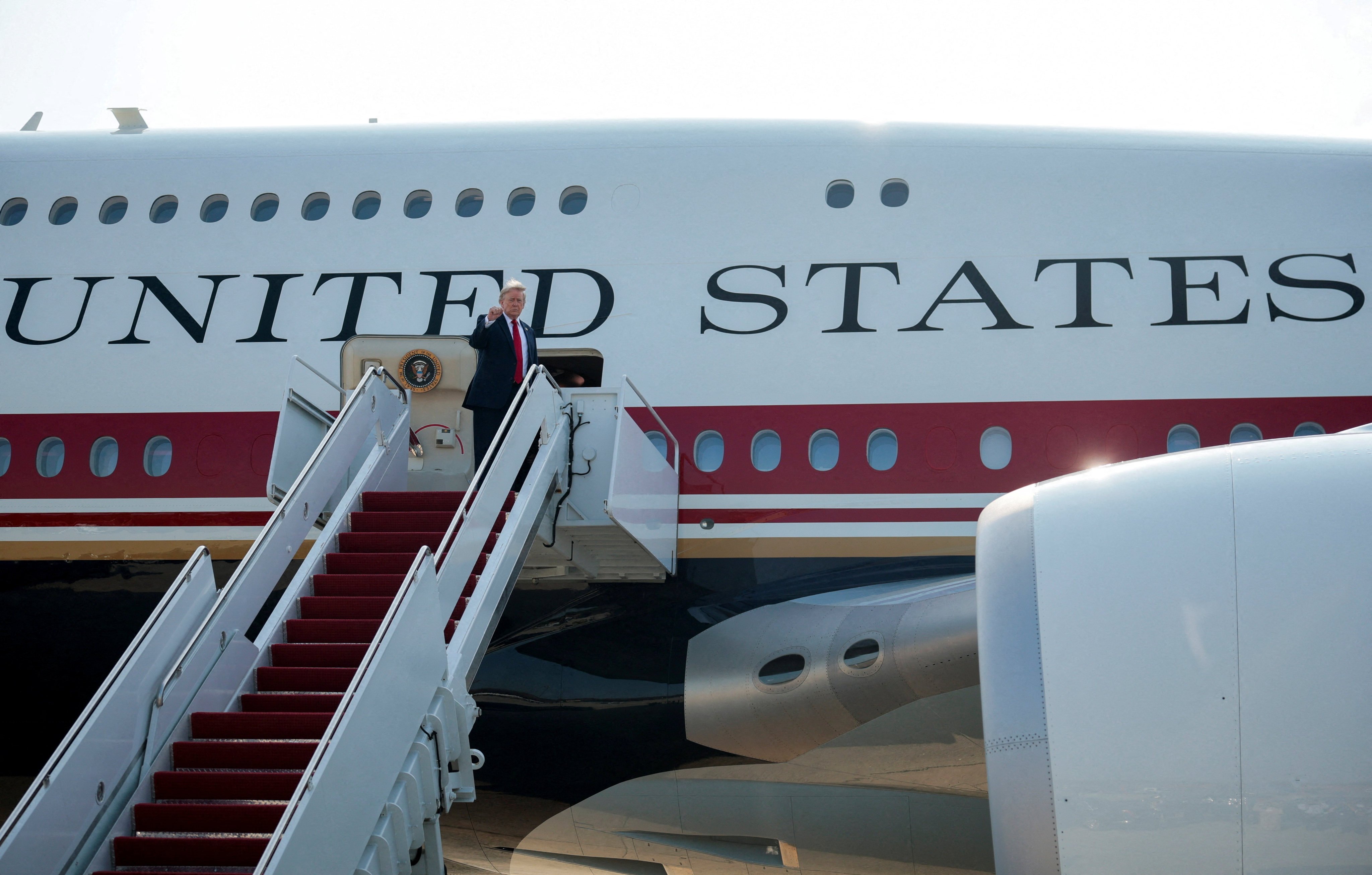 US President Donald Trump boarding the aircraft. Photo: Reuters