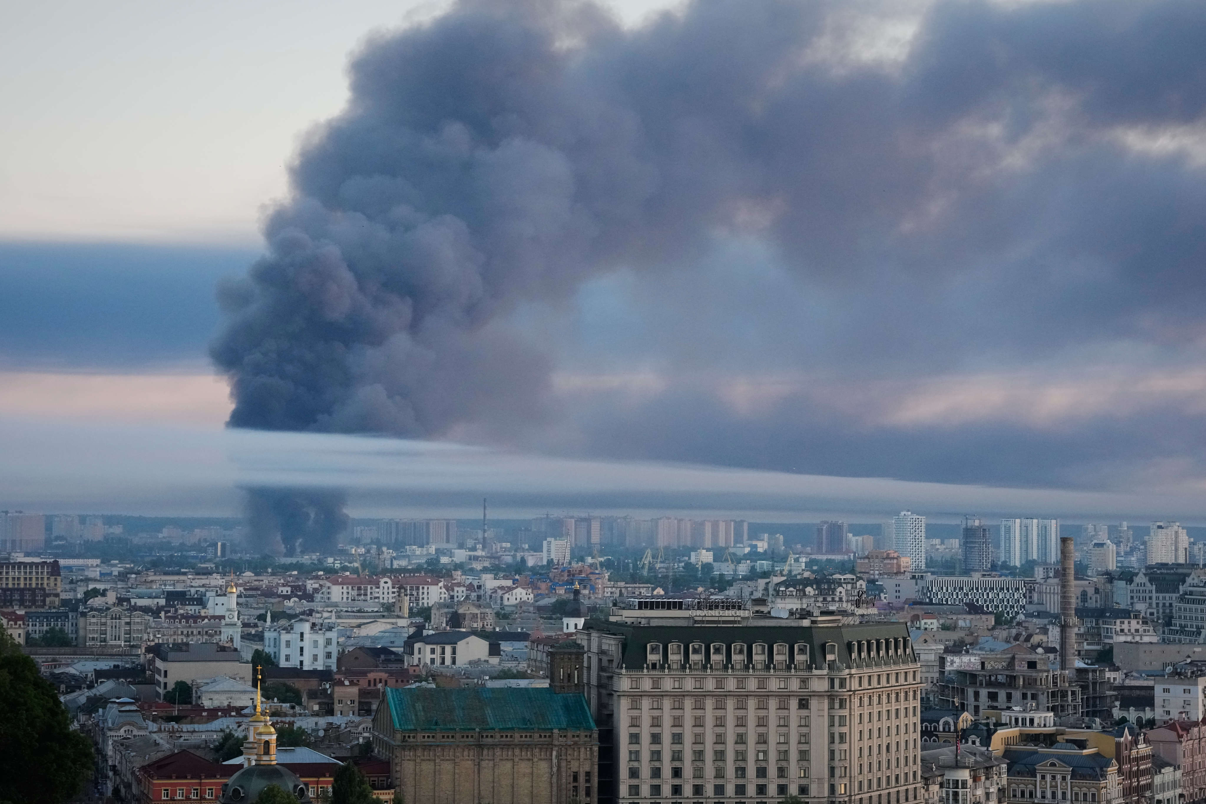 Smoke rises over Kyiv. Photo: AP