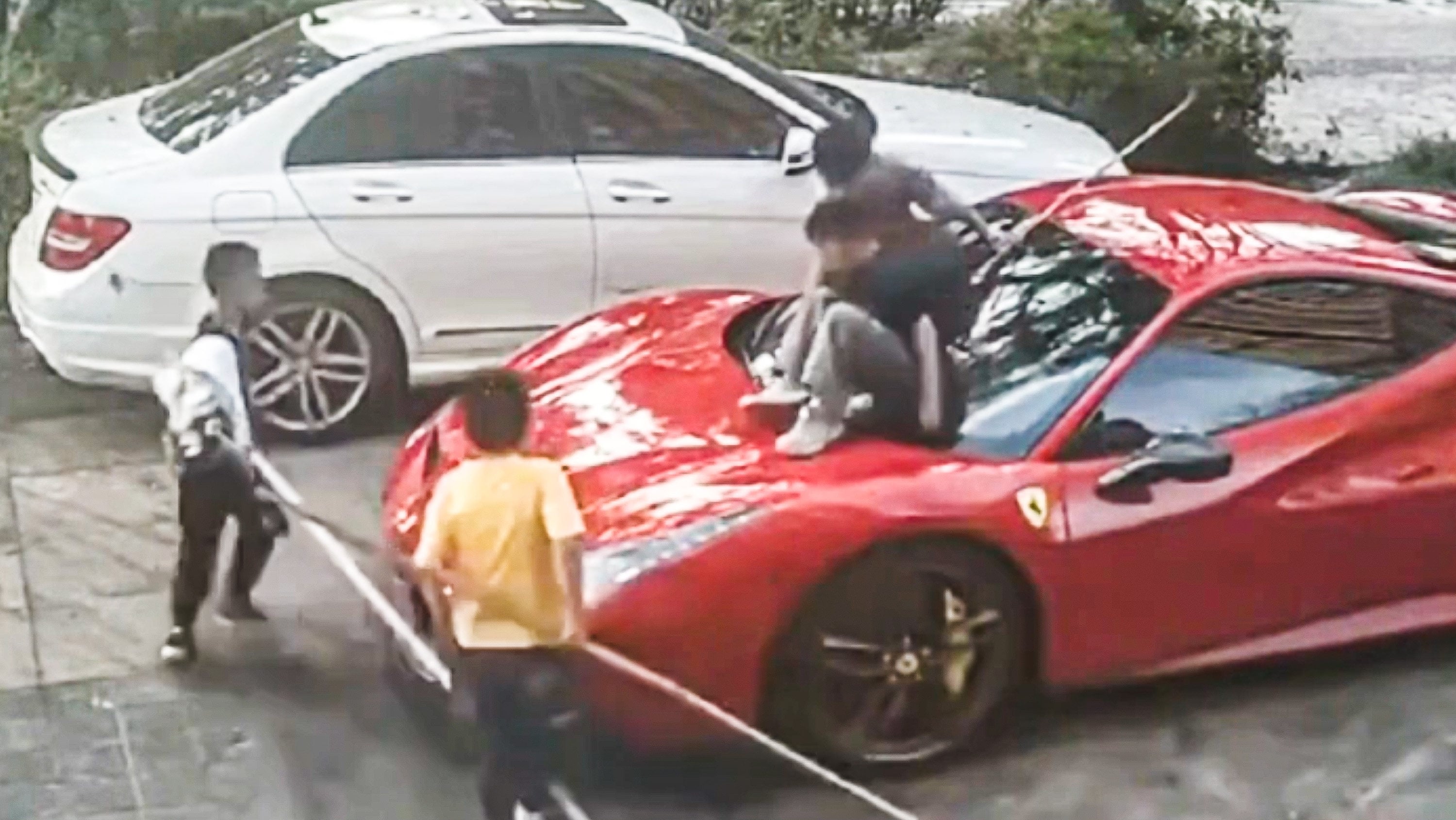 A Chinese Ferrari owner is suing the parents of four children who severely scratched his 3.6 million yuan supercar by climbing all over it. Photo: Douyin