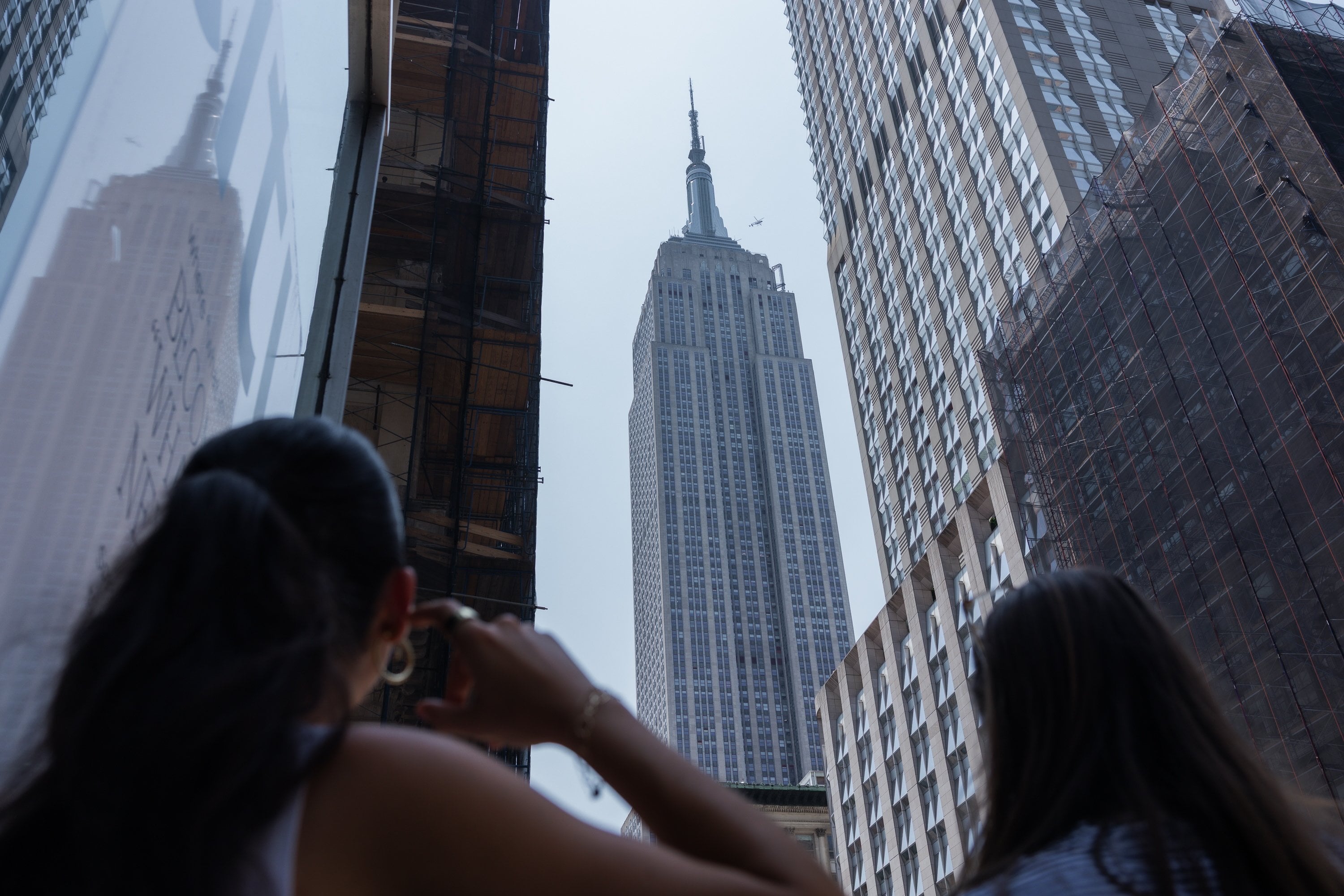 People look up at the Empire State Building. Photo: EPA