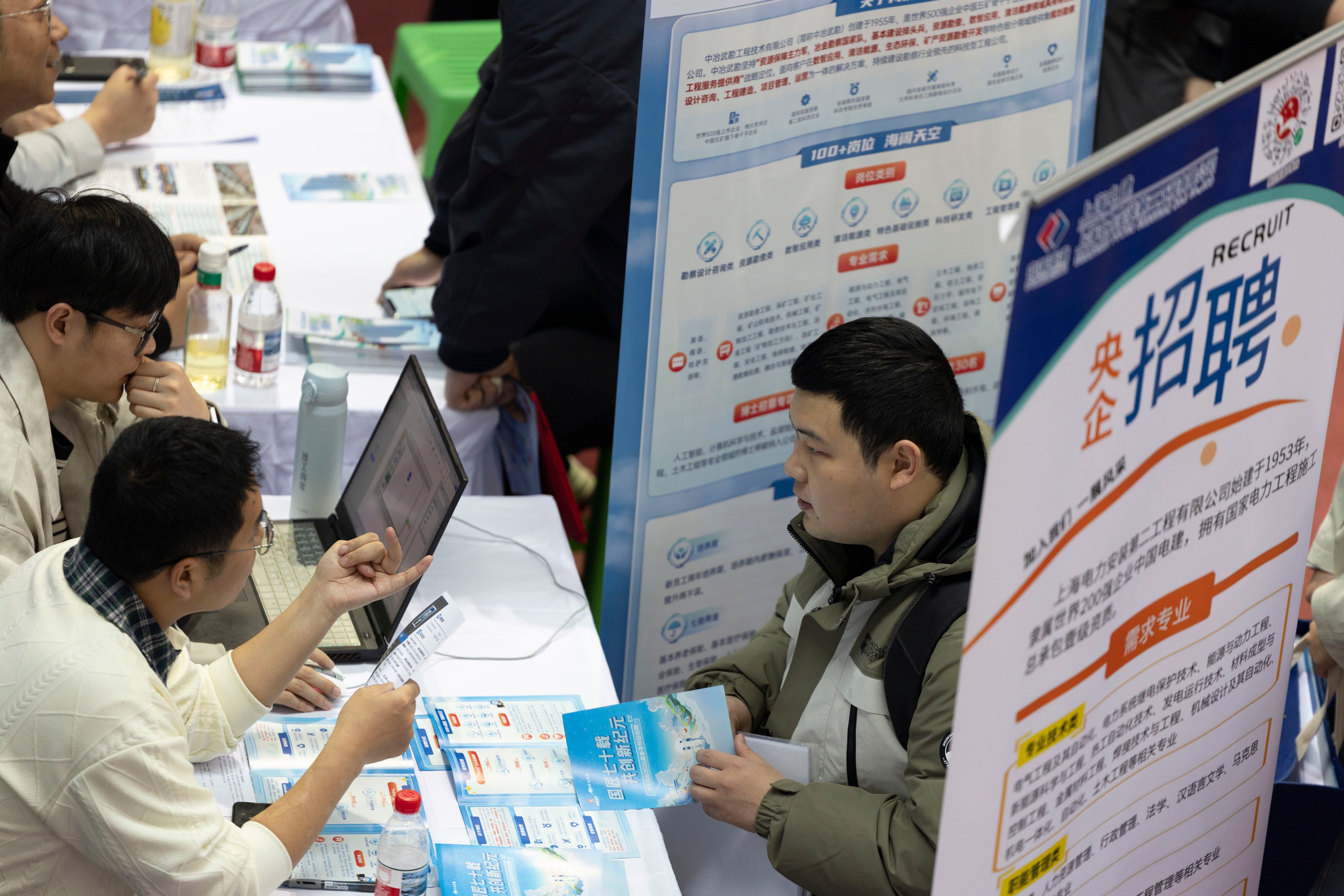 A university student inquires about employment opportunities at a recruitment fair for science and engineering universities in Harbin, Heilongjiang province, in March. Photo: Getty Images