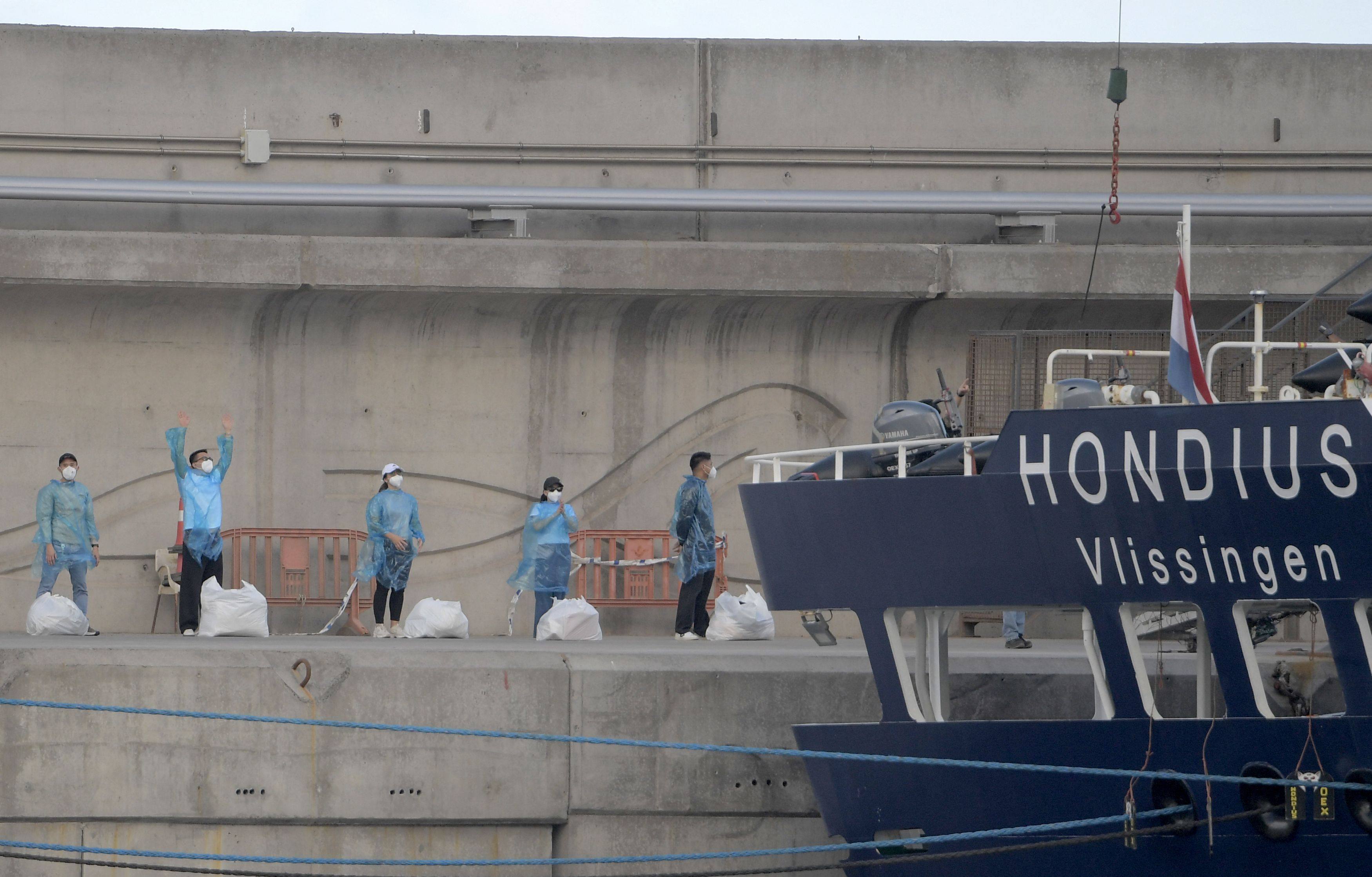 People in protective gear after disembarking from the MV Hondius in Tenerife, Spain’s Canary Islands, in May. Photo: AFP