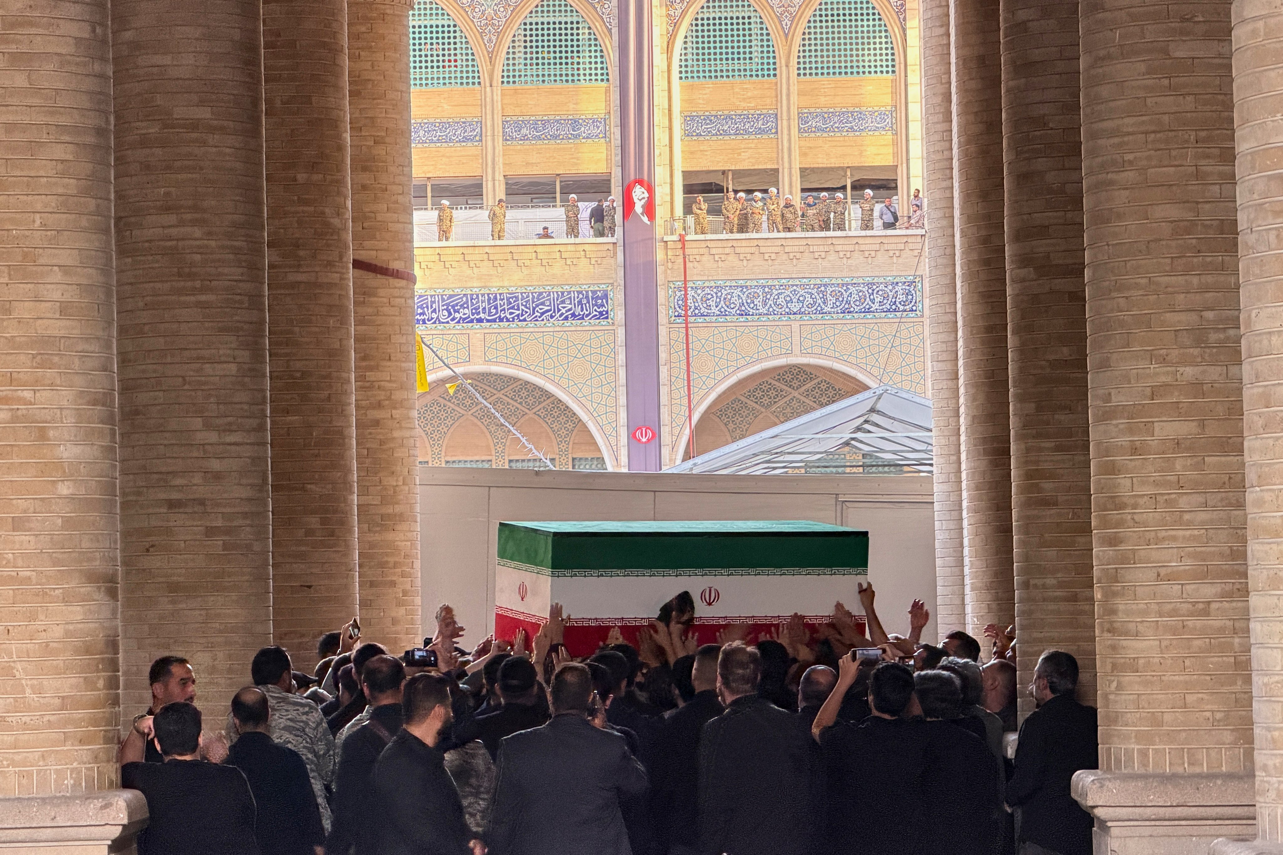 The coffin of slain Iranian supreme leader Ayatollah Ali Khamenei being carried into the Grand Mosalla. Photo: AP