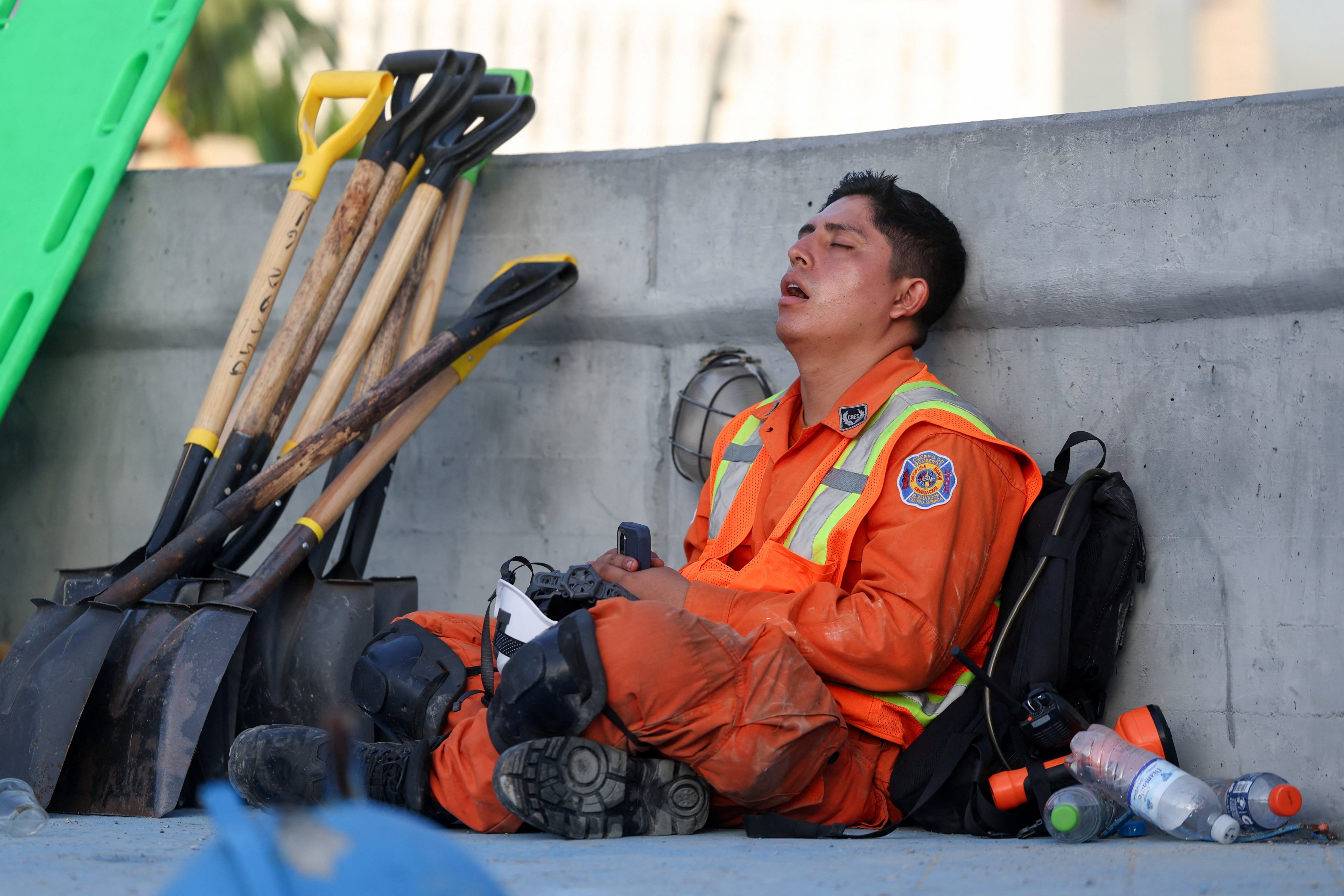 A Salvadoran firefighter rests. Photo: Reuters