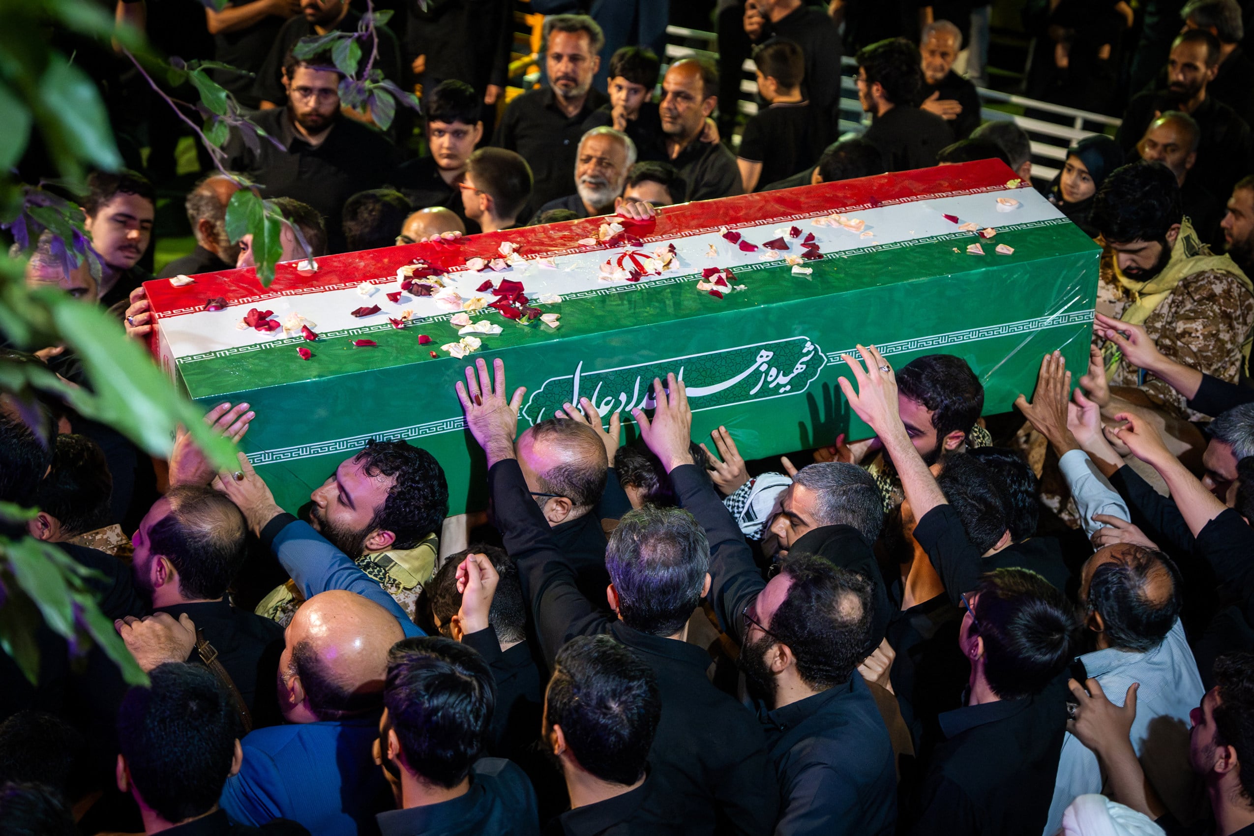 Mourners carry the coffin of Zahra Haddad Adel, wife of Iran’s supreme leader Mojtaba Khamenei, during her funeral in Tehran on July 2, 2026. Mojtaba Khamenei’s wife, Zahra Haddad Adel, the daughter of former parliament speaker Gholam Ali Haddad Adel, died on February 28 in the US-Israeli strikes that killed ex-supreme leader Khamenei, according to the Iranian authorities. (Photo by FARS NEWS AGENCY / AFP)