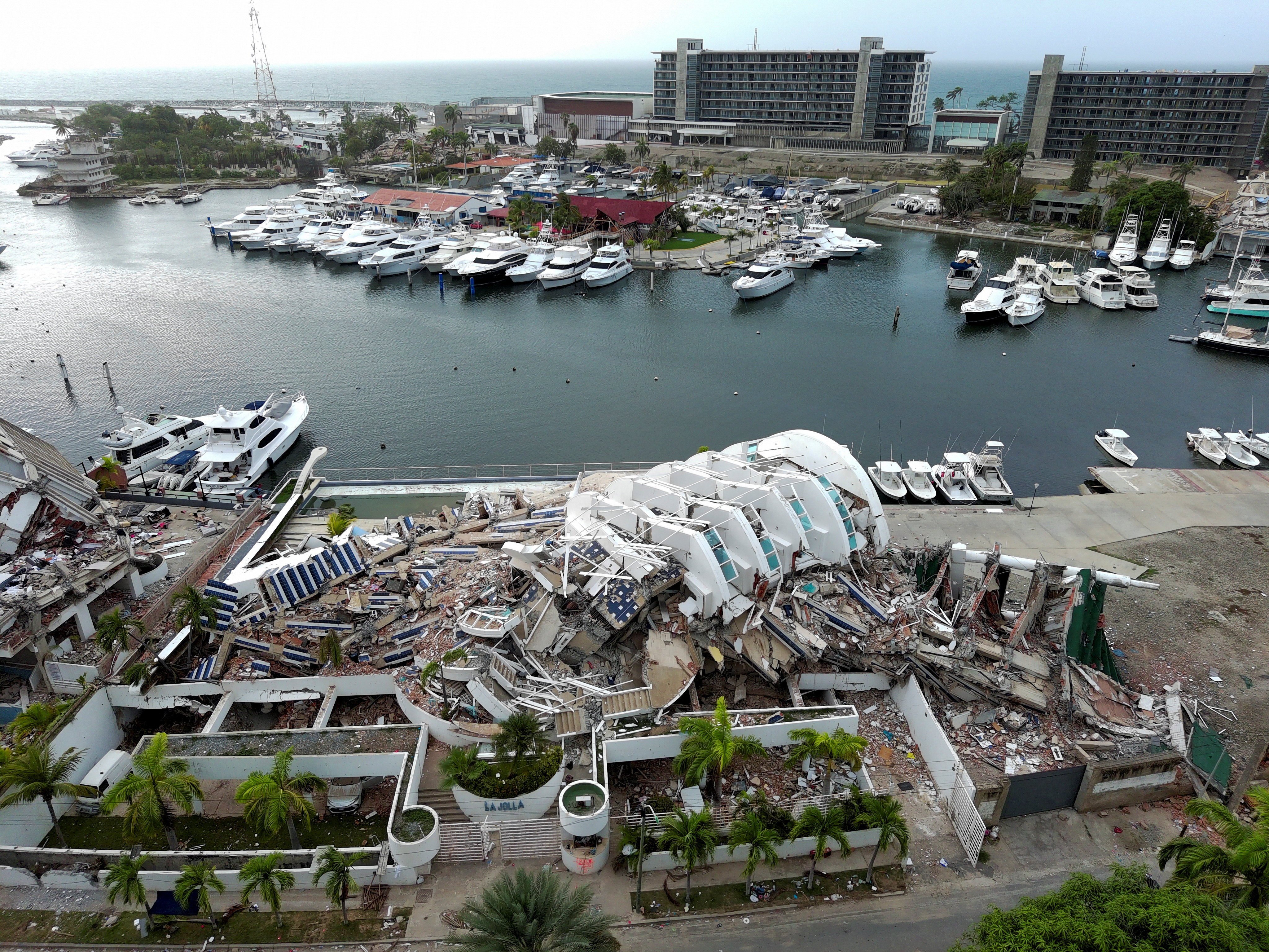 Collapsed buildings near a marina. Photo: Reuters