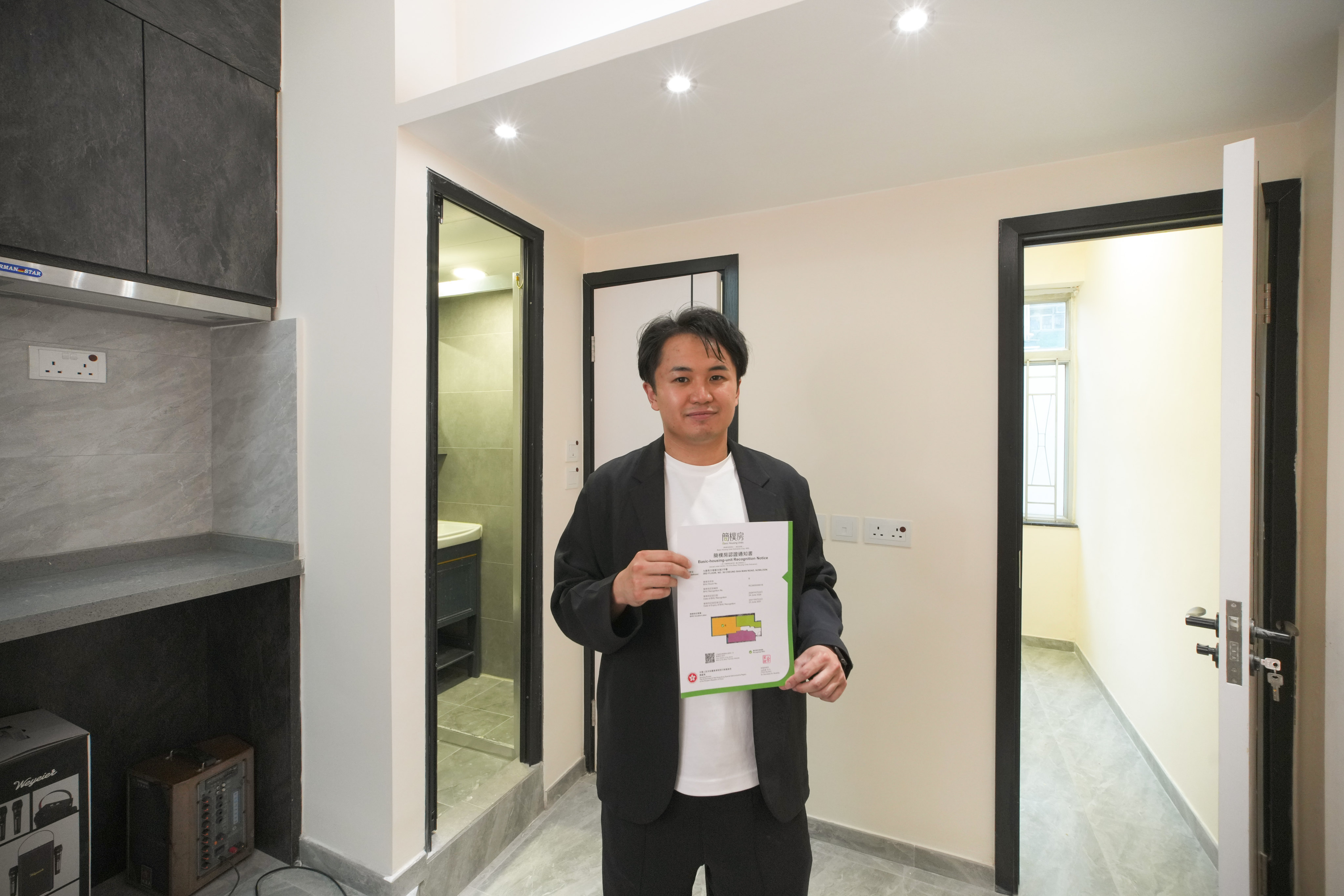 Hayson Chan Hin-hay, chairman of the Hong Kong Basic Housing Units Operators Association, whose three subdivided units in a Sham Shui Po flat have been approved as basic housing units. Photo: Dickson Lee
