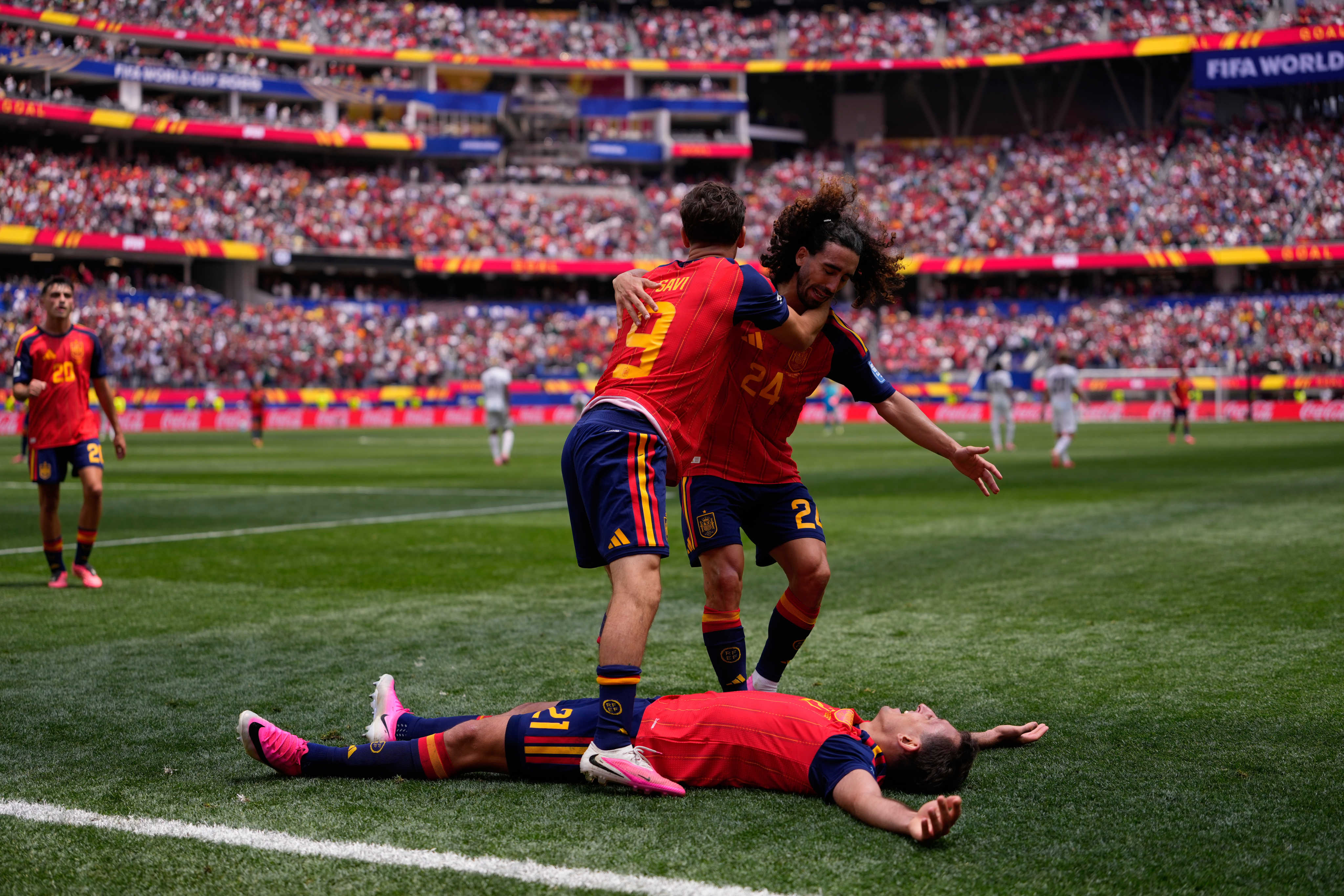 Spain’s Mikel Oyarzabal (centre) celebrates scoring his side’s third against Austria with teammates Gavi (left) and Marc Cucurella. Photo: AP